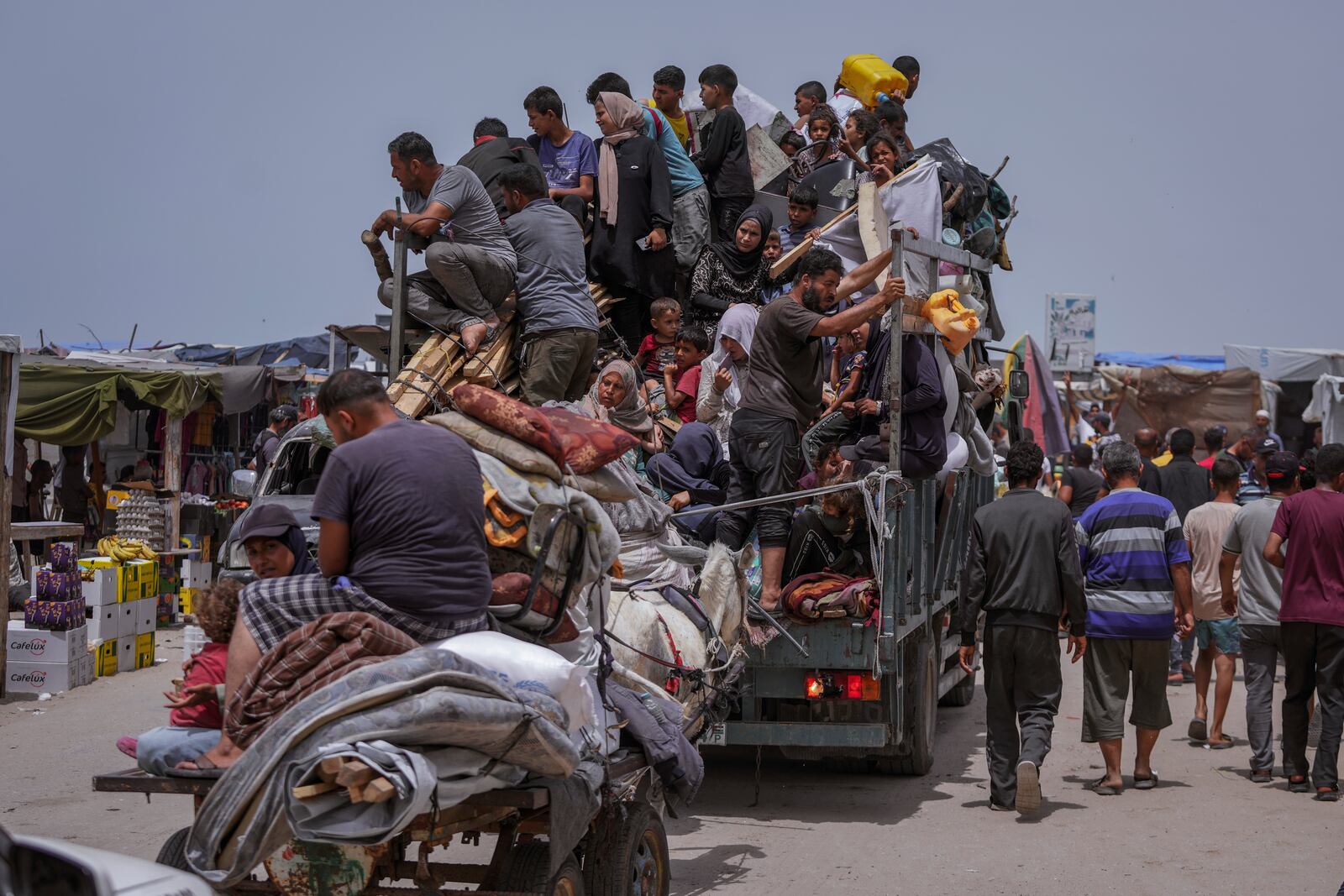 FILE - Palestinians flee from the southern Gaza city of Rafah during an Israeli ground and air offensive May 28, 2024. (AP Photo/Abdel Kareem Hana, File)