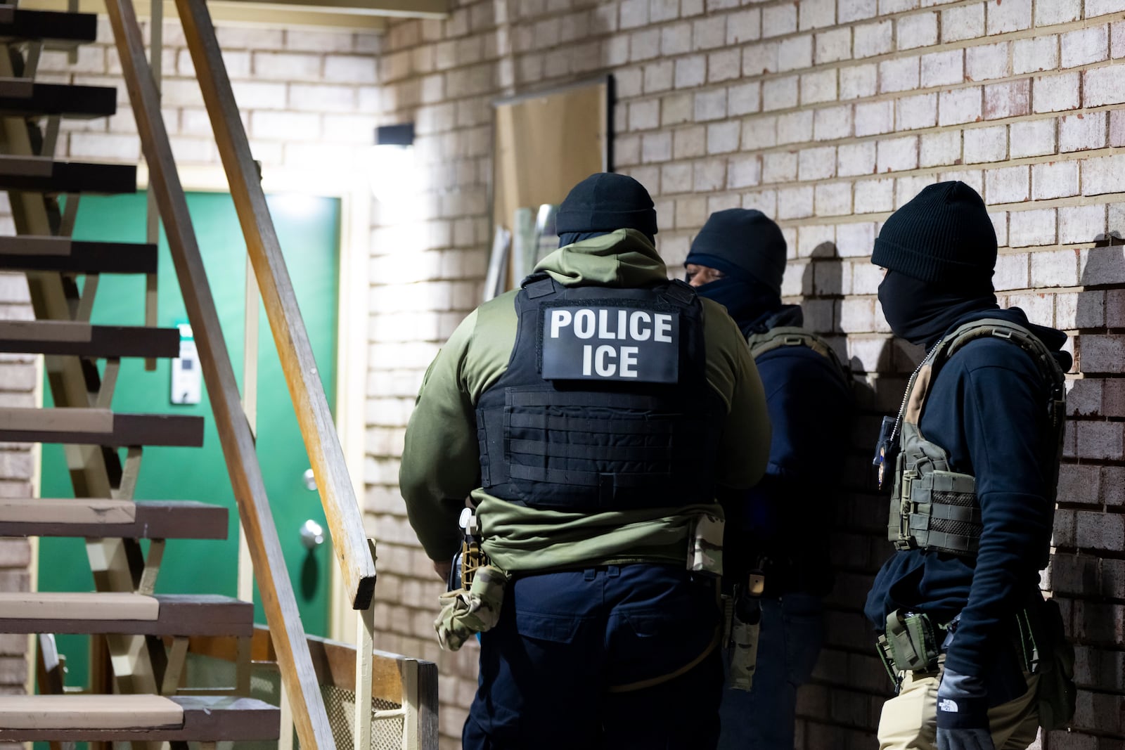 FILE - U.S. Immigration and Customs Enforcement officers wait to detain a person, Jan. 27, 2025, in Silver Spring, Md. (AP Photo/Alex Brandon, File)