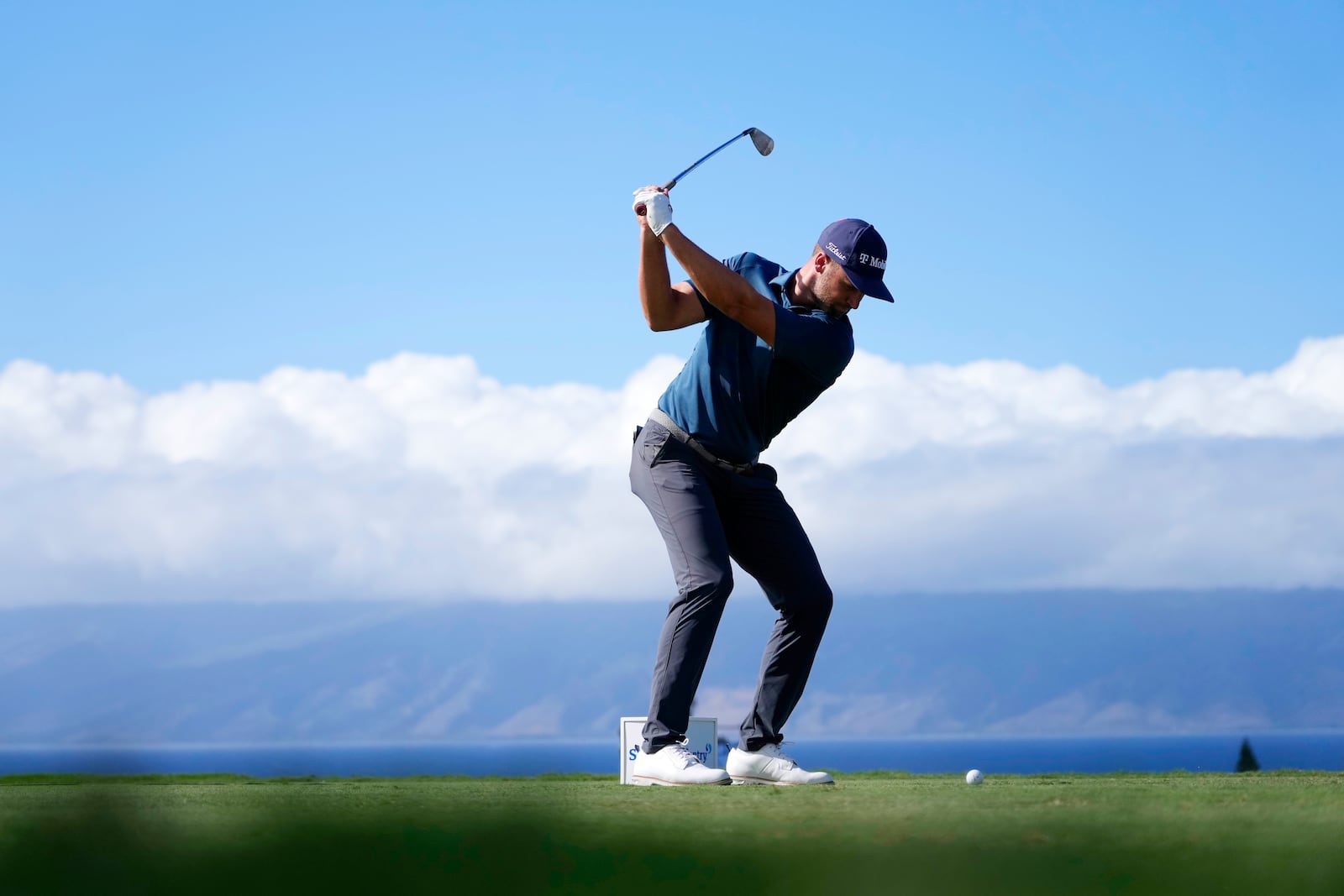 Wyndham Clark hits his tee shot at the 11th hole during the second round of The Sentry golf event, Friday, Jan. 3, 2025, at the Kapalua Plantation Course in Kapalua, Hawaii. (AP Photo/Matt York)