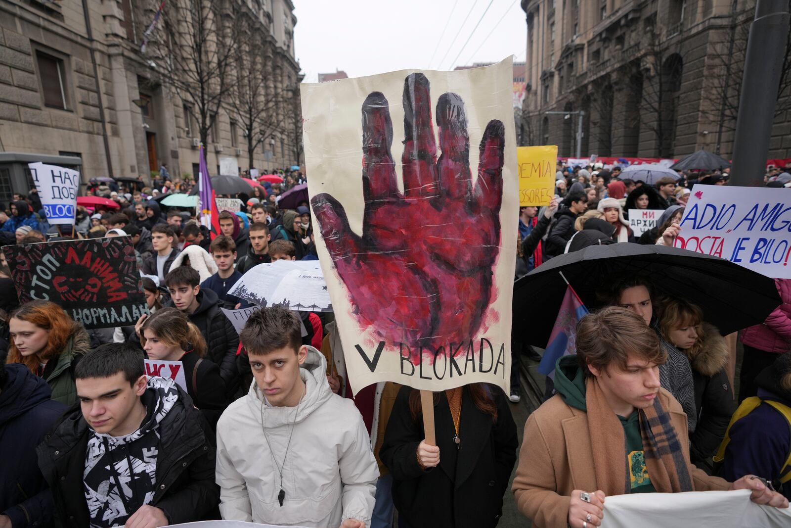 Students call for a general strike as they stop traffic during a protest to commemorate the 15 victims killed after a railway concrete canopy fell in November and to demand accountability for the tragedy, in Belgrade, Serbia, Friday, Jan. 24, 2025. (AP Photo/Darko Vojinovic)