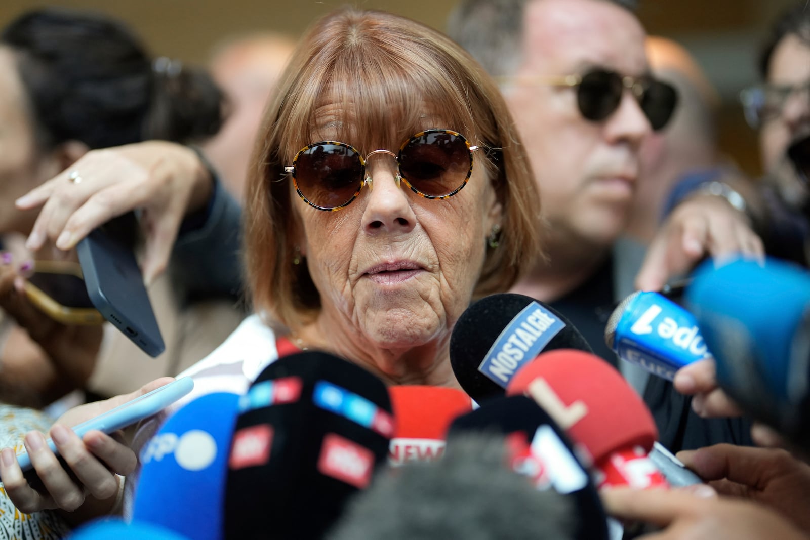 FILE - Gisele Pelicot speaks to media as she leaves the Avignon court house, southern France, on Sept. 5, 2024. (AP Photo/Lewis Joly, File)