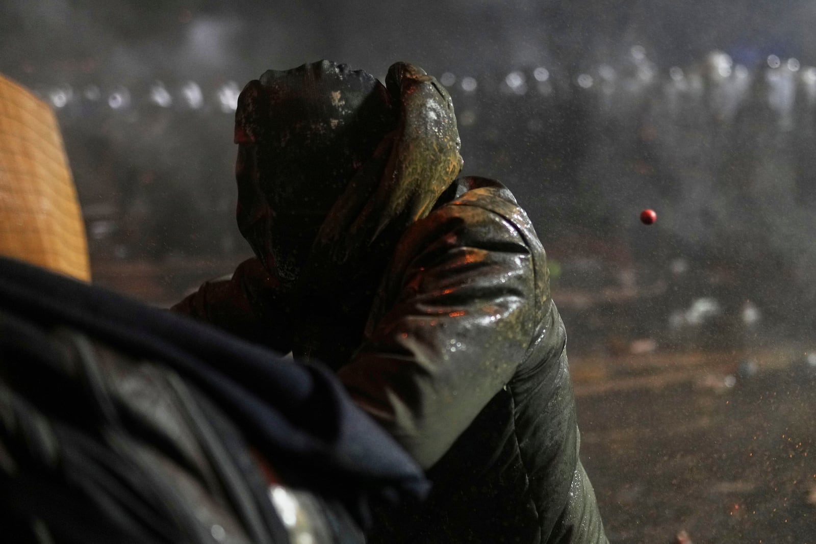 Riot police fire tear gas bullets against protesters during a protest against the arrest of Istanbul's Mayor Ekrem Imamoglu, in Istanbul, Turkey, Saturday, March 22, 2025. (AP Photo/Francisco Seco)