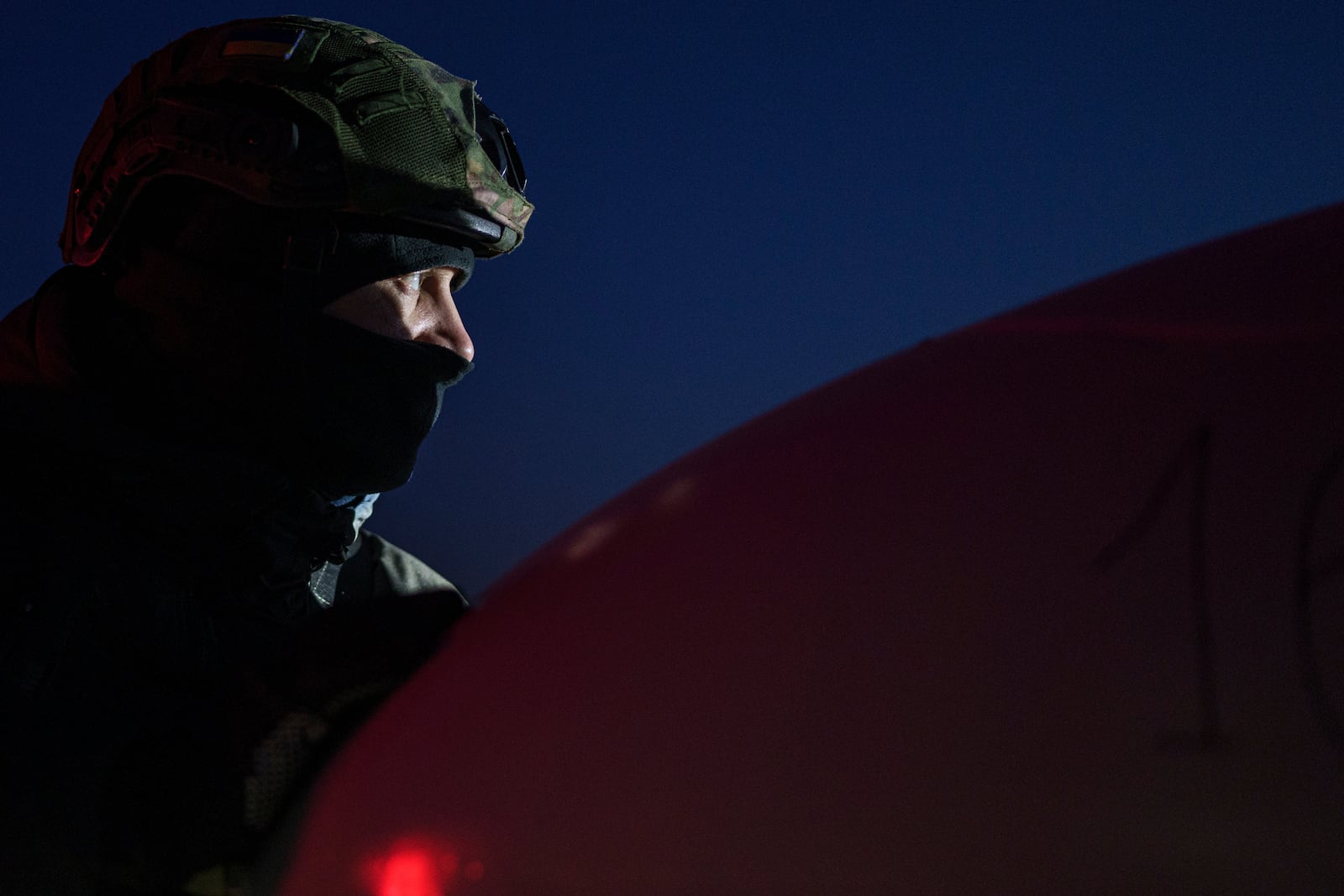 An Ukrainian serviceman of the Defence Intelligence prepares to launch long-range drone An-196 Liutyi in undisclosed location, Ukraine, Feb. 28, 2025. (AP Photo/Evgeniy Maloletka)