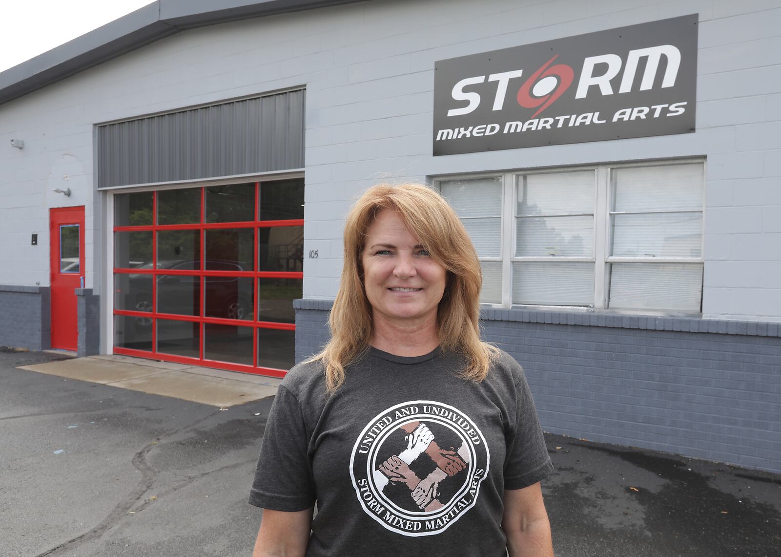 Sandy Bise, owner of Storm Mixed Martial Arts, in their new training center on North Thompson Avenue Thursday. BILL LACKEY/STAFF