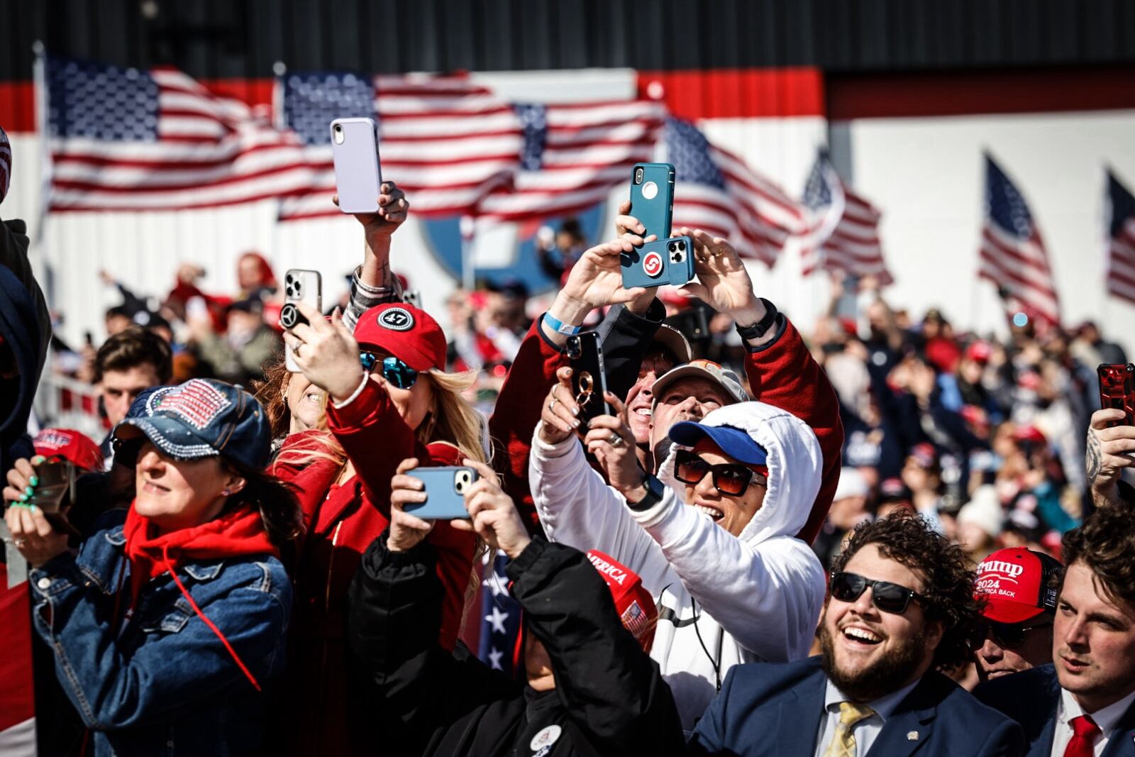 Trump fans celebrate the Republican presidential candidate Donald Trump at Wright Bros Aero Inc.Jim Noelker/Staff 