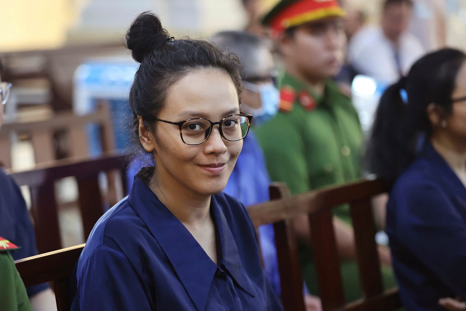 Truong Hue Van, niece of Vietnamese real estate tycoon Truong My Lan, sits in court to wait for her verdict for her involvement in Lan's case in Ho Chi Minh city, Vietnam Thursday, Oct. 17, 2024. (Quynh Tran/VNExpress via AP)