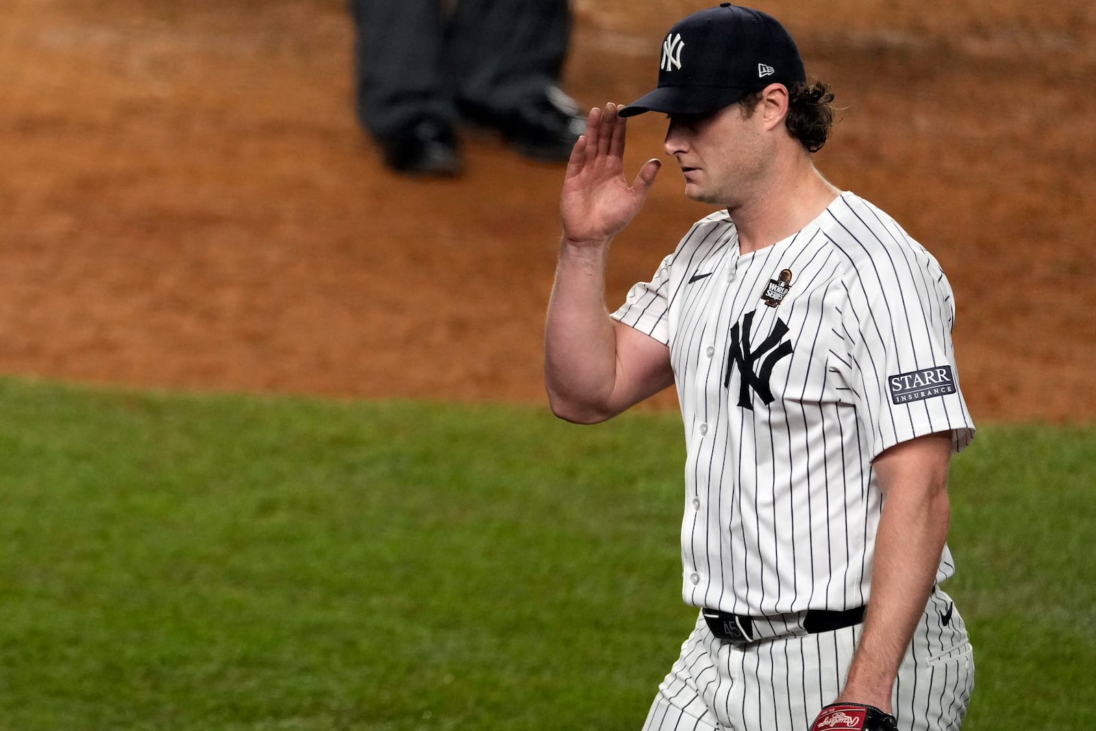 New York Yankees starting pitcher Gerrit Cole acknowledges the crowd as he leaves during the seventh inning in Game 5 of the baseball World Series against the Los Angeles Dodgers, Wednesday, Oct. 30, 2024, in New York. (AP Photo/Seth Wenig)