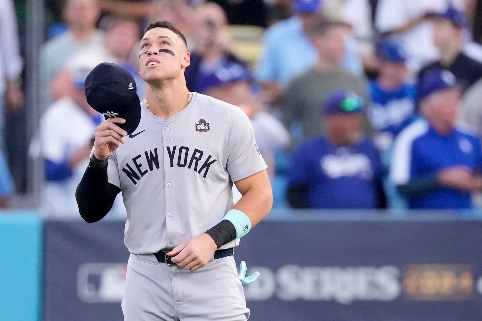 New York Yankees' Aaron Judge looks up in the outfield before Game 2 of the baseball World Series against the Los Angeles Dodgers, Saturday, Oct. 26, 2024, in Los Angeles. (AP Photo/Mark J. Terrill)