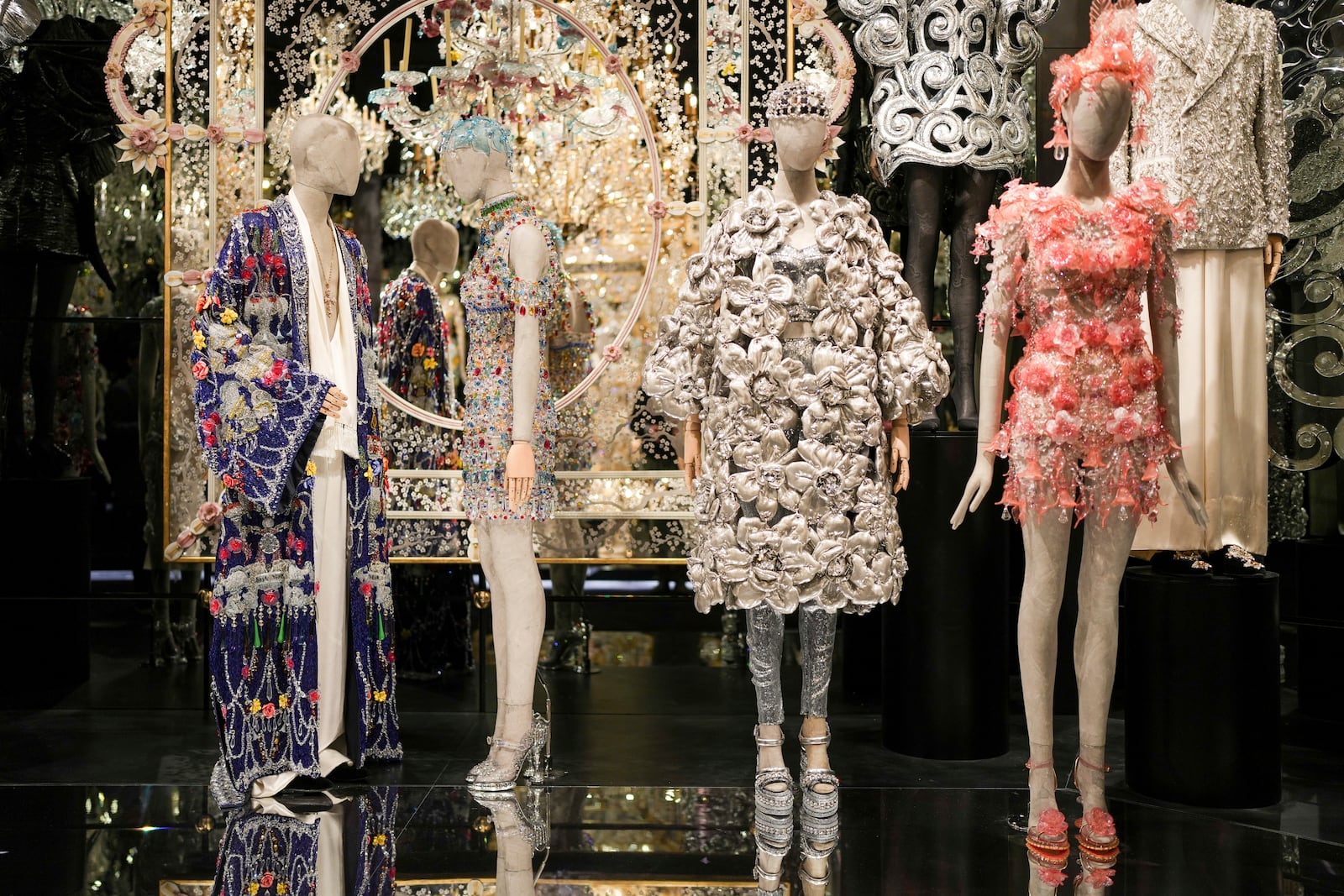 Creations are displayed during the exhibition "From the Heart to the Hands: Dolce&Gabbana" at the Grand Palais, in Paris, Thursday, Jan. 9, 2025. (AP Photo/Thibault Camus)