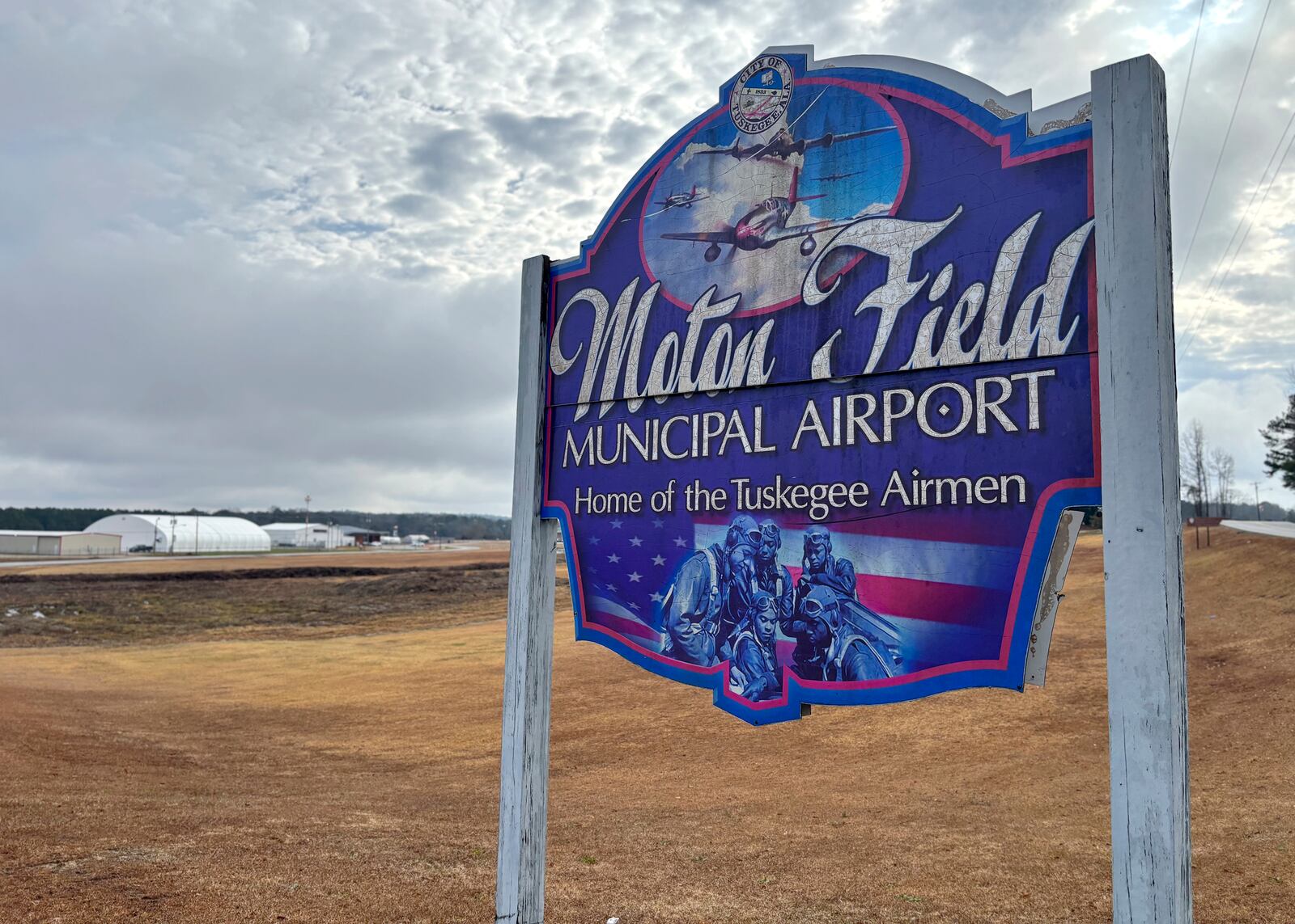 An airport sign paying tribute to the Tuskegee Airmen who once trained at the site is pictured at Tuskegee Moton Field Municipal Airport in Tuskegee, Ala., Tuesday, Jan. 28, 2025. (Kim Chandler/Associated Press)