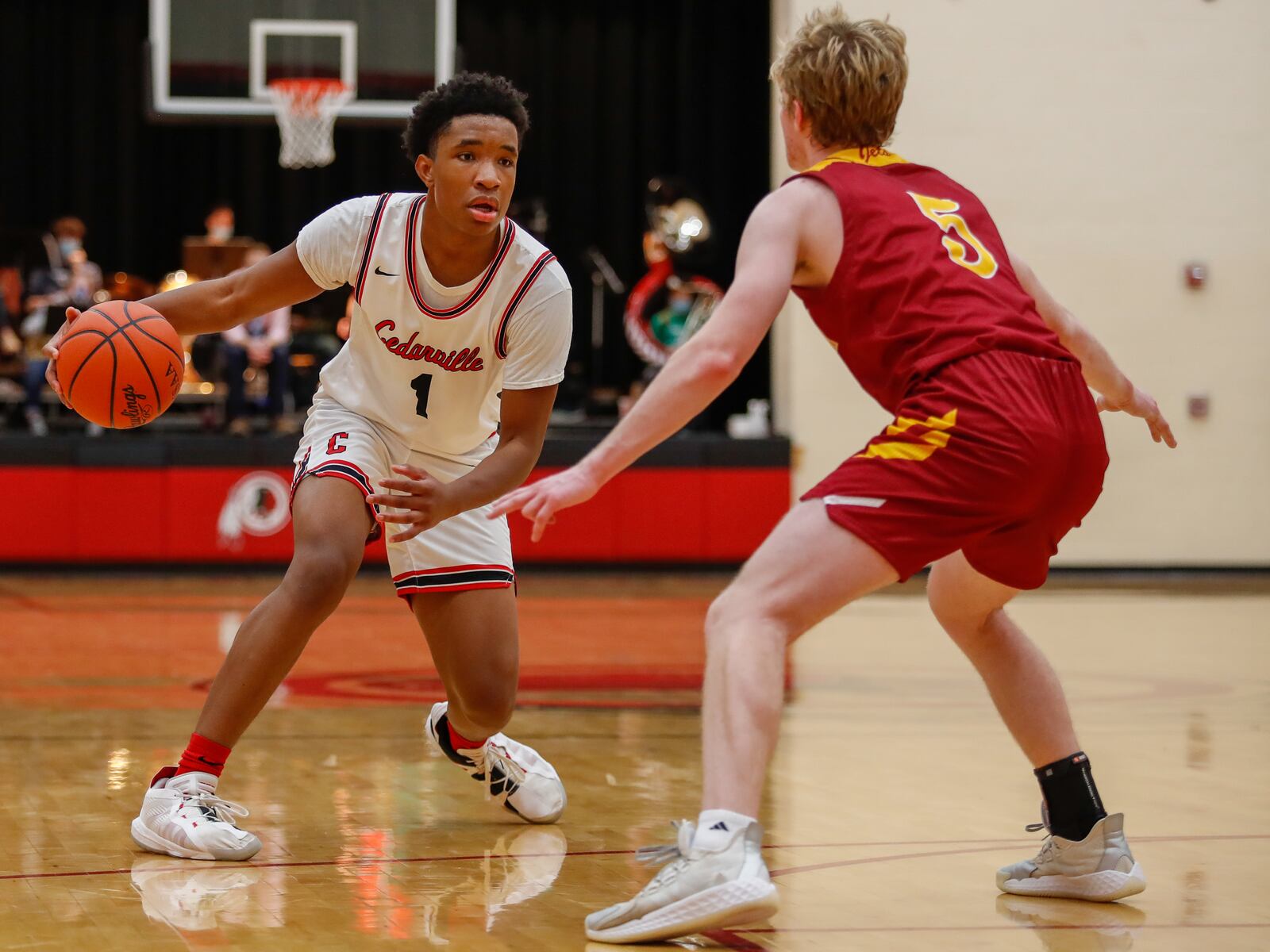 Cedarville High School senior Isaiah Ramey is guarded by Northeastern's Cole Allen during their game on Tuesday night in Cedarville. CONTRIBUTED PHOTO BY MICHAEL COOPER