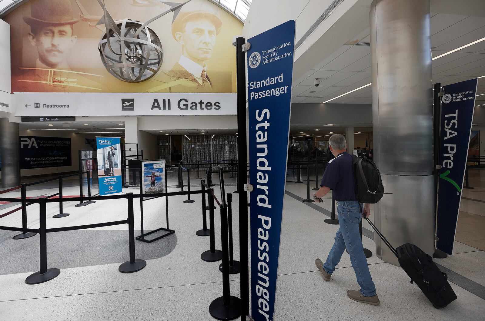 Travelers walk through Dayton International Airport Thursday, June 27, 2024. MARSHALL GORBY/STAFF