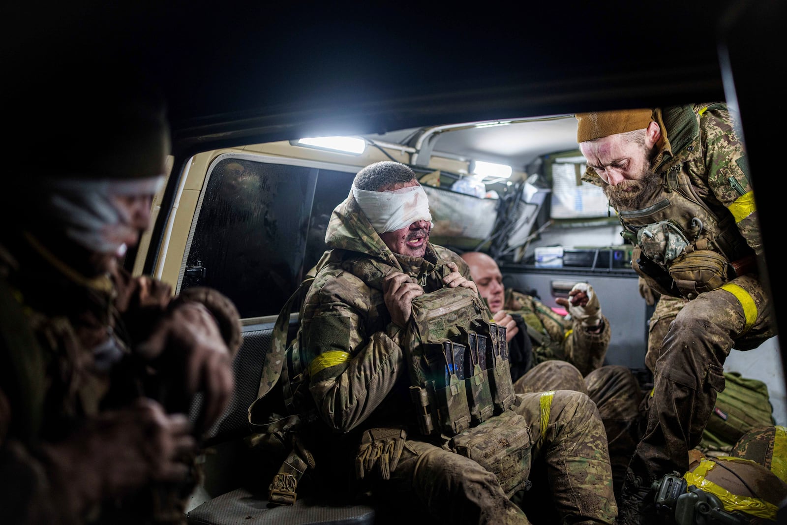 Injured Ukrainian servicemen arrive from the battlefield at Medical Service "Ulf" of the 108th Separate Battalion "Da Vinci Wolves" on Pokrovsk direction, Ukraine, Monday, Dec. 23, 2024. (AP Photo/Evgeniy Maloletka)