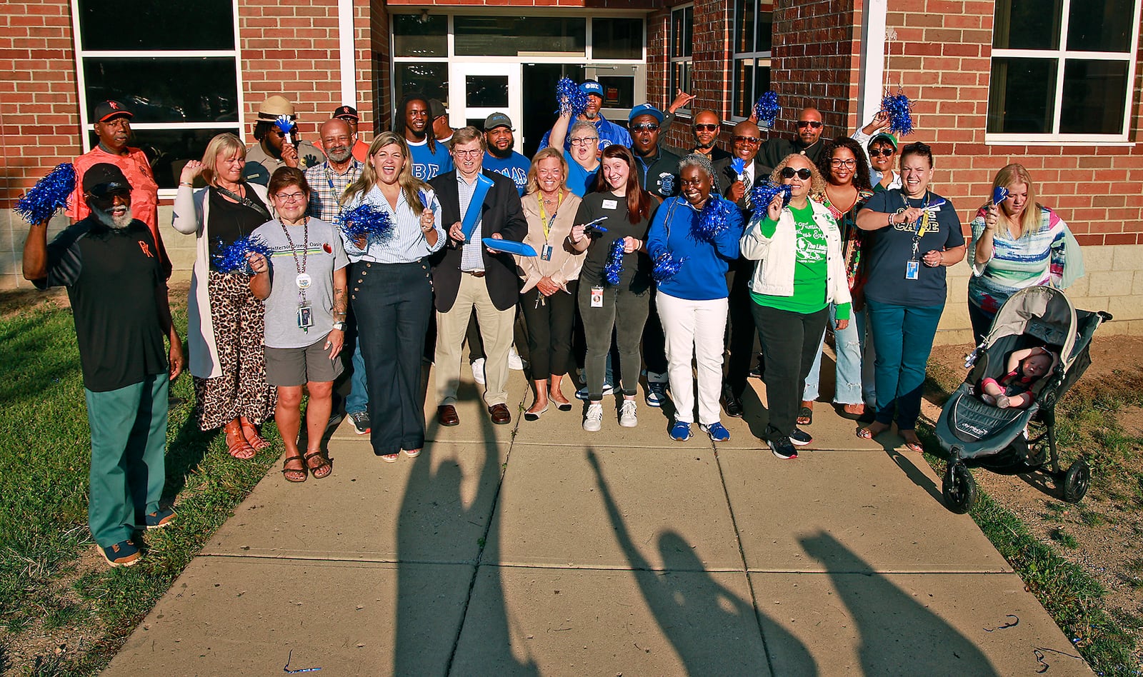 Community members at Fulton Elementary School for the "First Day Clap-In" Wednesday, August 14, 2024. BILL LACKEY/STAFF