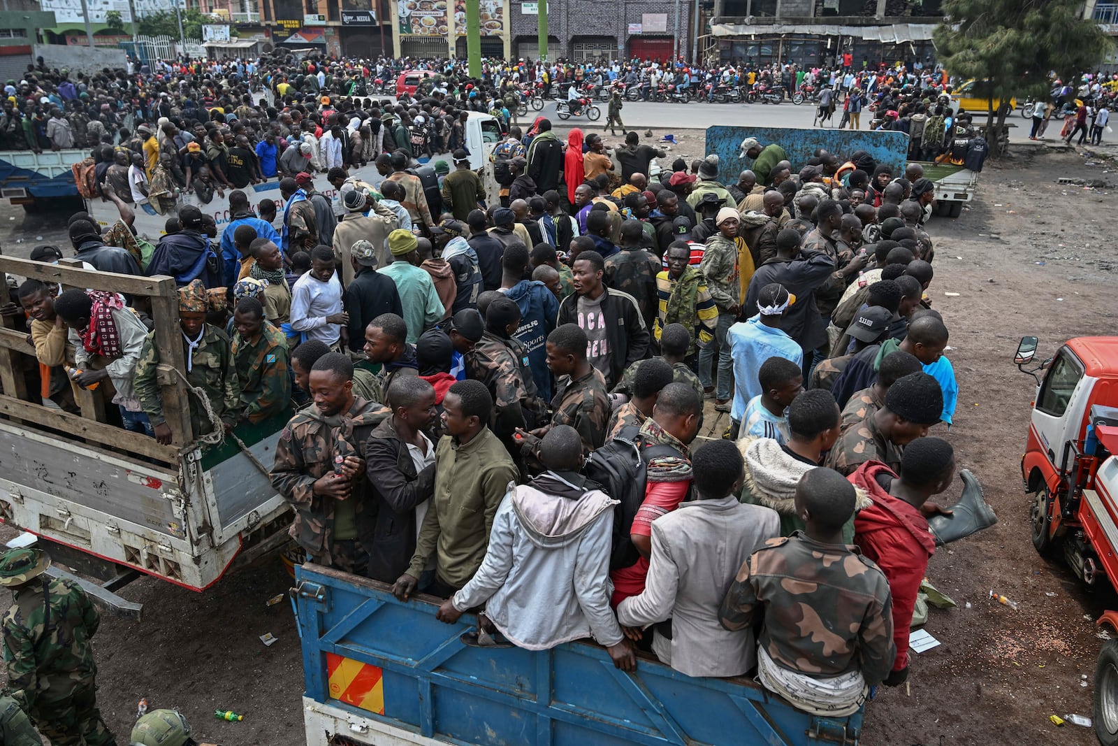 M23 rebels escort government soldiers and police who surrendered to an undisclosed location in Goma, Democratic republic of the Congo, Thursday, Jan. 30, 2025. (AP Photo/Moses Sawasawa)