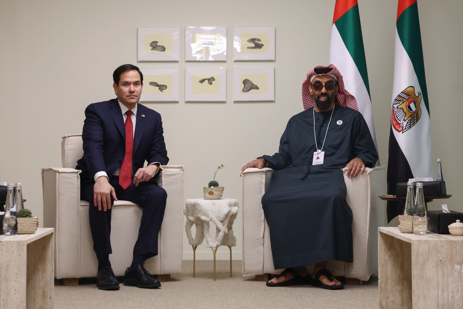 U.S. Secretary of State Marco Rubio, left, poses for a photo with UAE National Security Advisor Sheikh Tahnoon bin Zayed Al Nahyan at ADNEC Centre Abu Dhabi in Abu Dhabi, United Arab Emirates, Wednesday, Feb. 19, 2025. (Evelyn Hockstein/Pool Photo via AP)