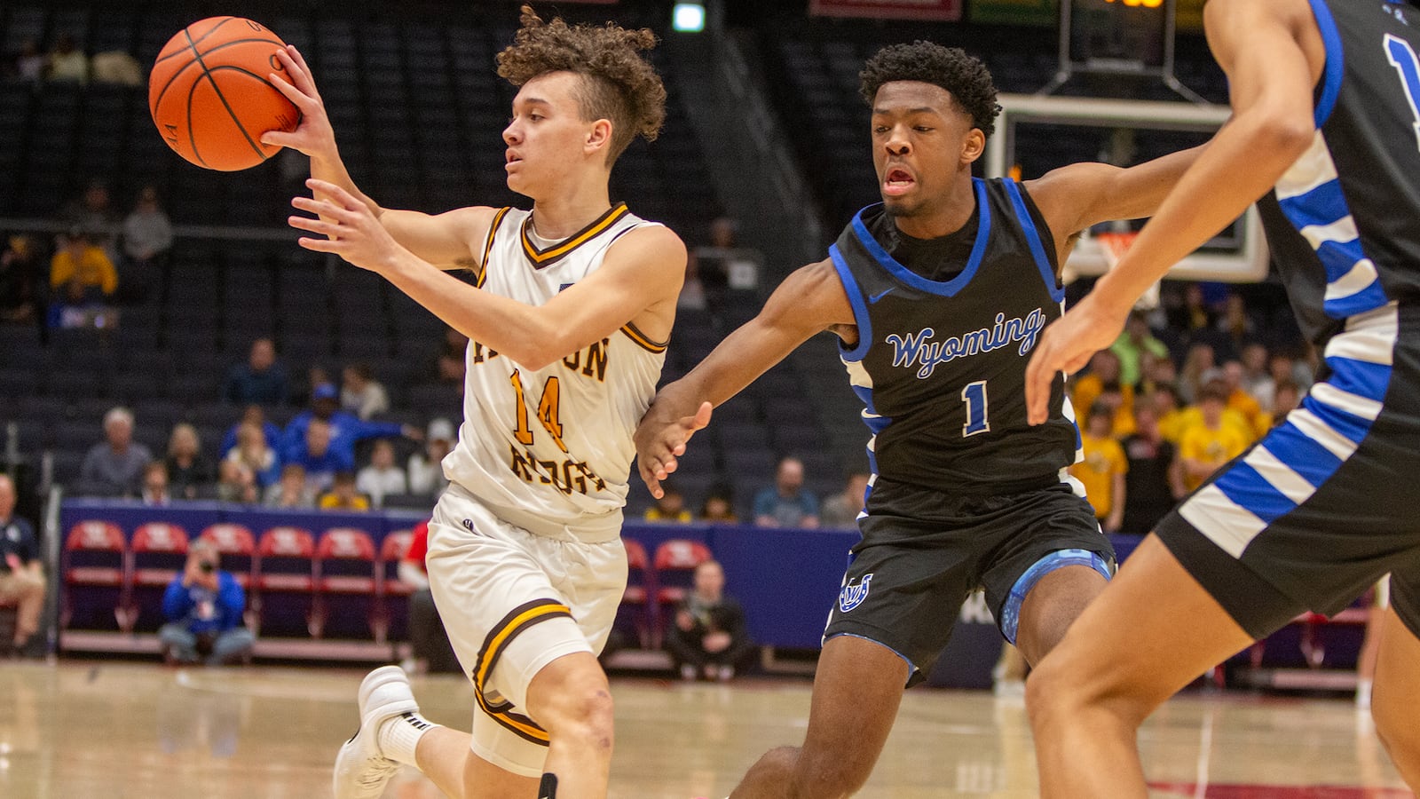 Kenton Ridge's Xavier White pass to the corner in the first half of Saturday's Division II district final at UD Arena against Cincinnati Wyoming. Jeff Gilbert/CONTRIBUTED