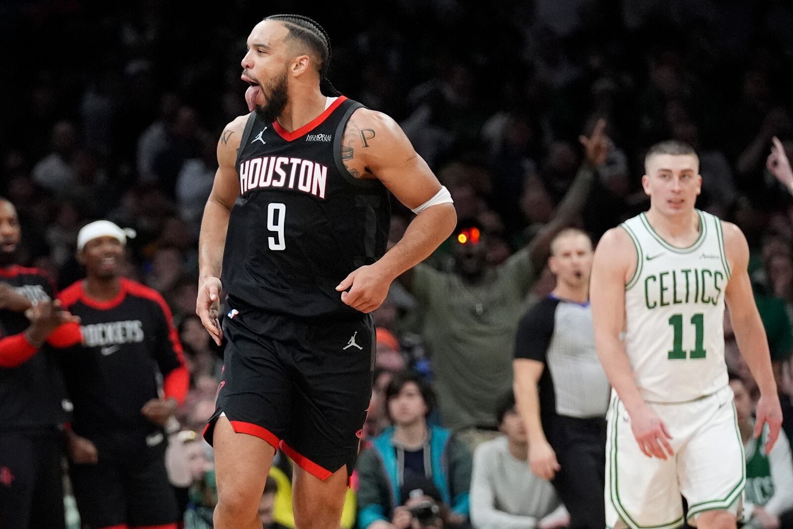 Houston Rockets forward Dillon Brooks (9) celebrates after making a basket against the Boston Celtics during the second half of an NBA basketball game, Monday, Jan. 27, 2025, in Boston. (AP Photo/Charles Krupa)