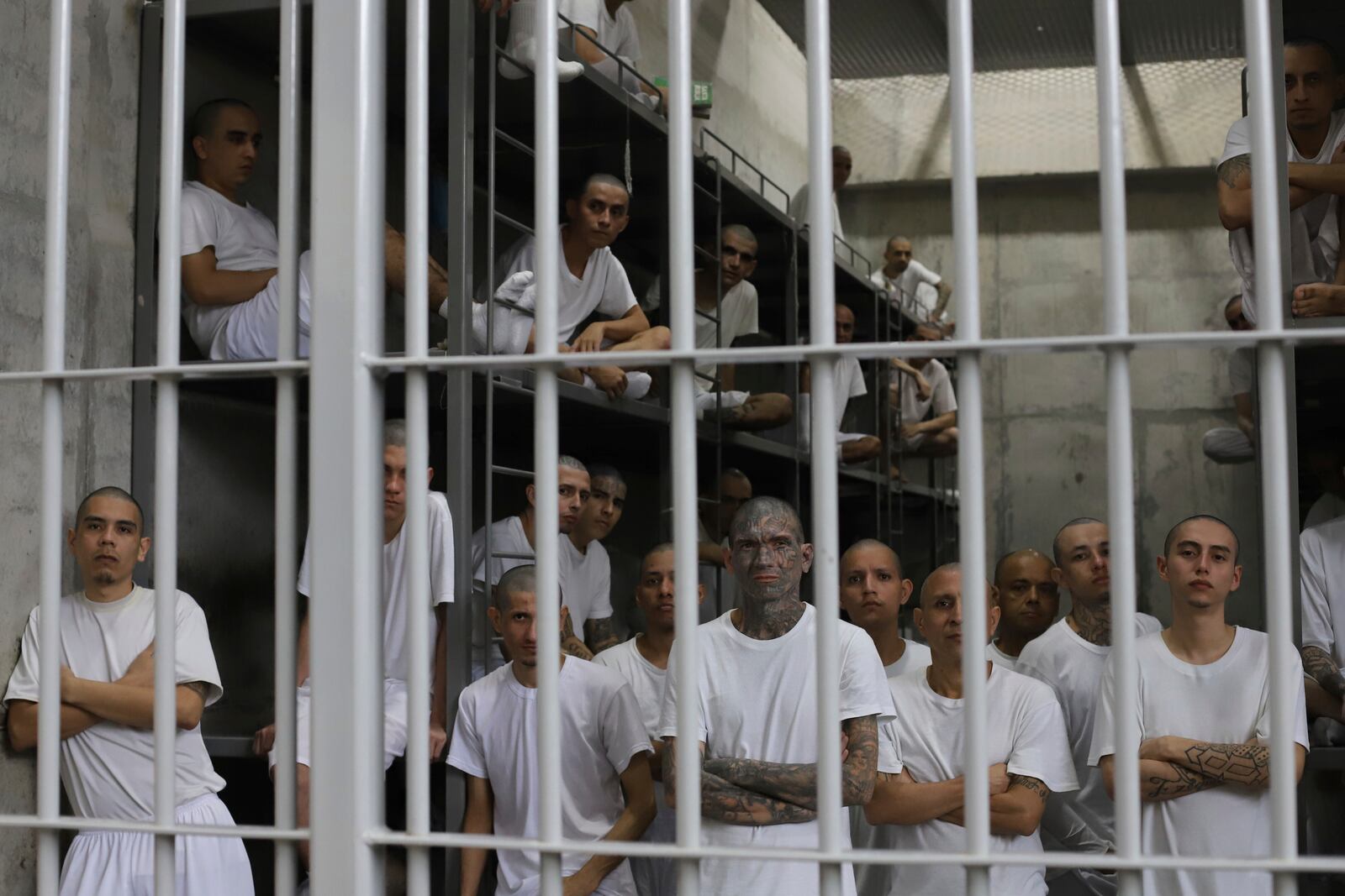 FILE - Inmates attend a class on social behavior from inside their shared cell during a press tour of the Terrorism Confinement Center, or CECOT, in Tecololuca, El Salvador, Oct. 12, 2023. (AP Photo/Salvador Melendez, File)