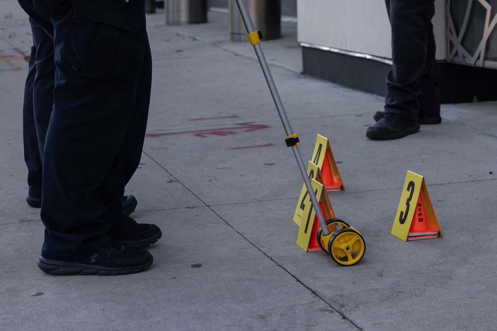 NYPD officers stand at the site where the suspect of a stabbing spree was captured outside Turkish House, New York, Monday, Nov. 18, 2024. (AP Photo/Yuki Iwamura)