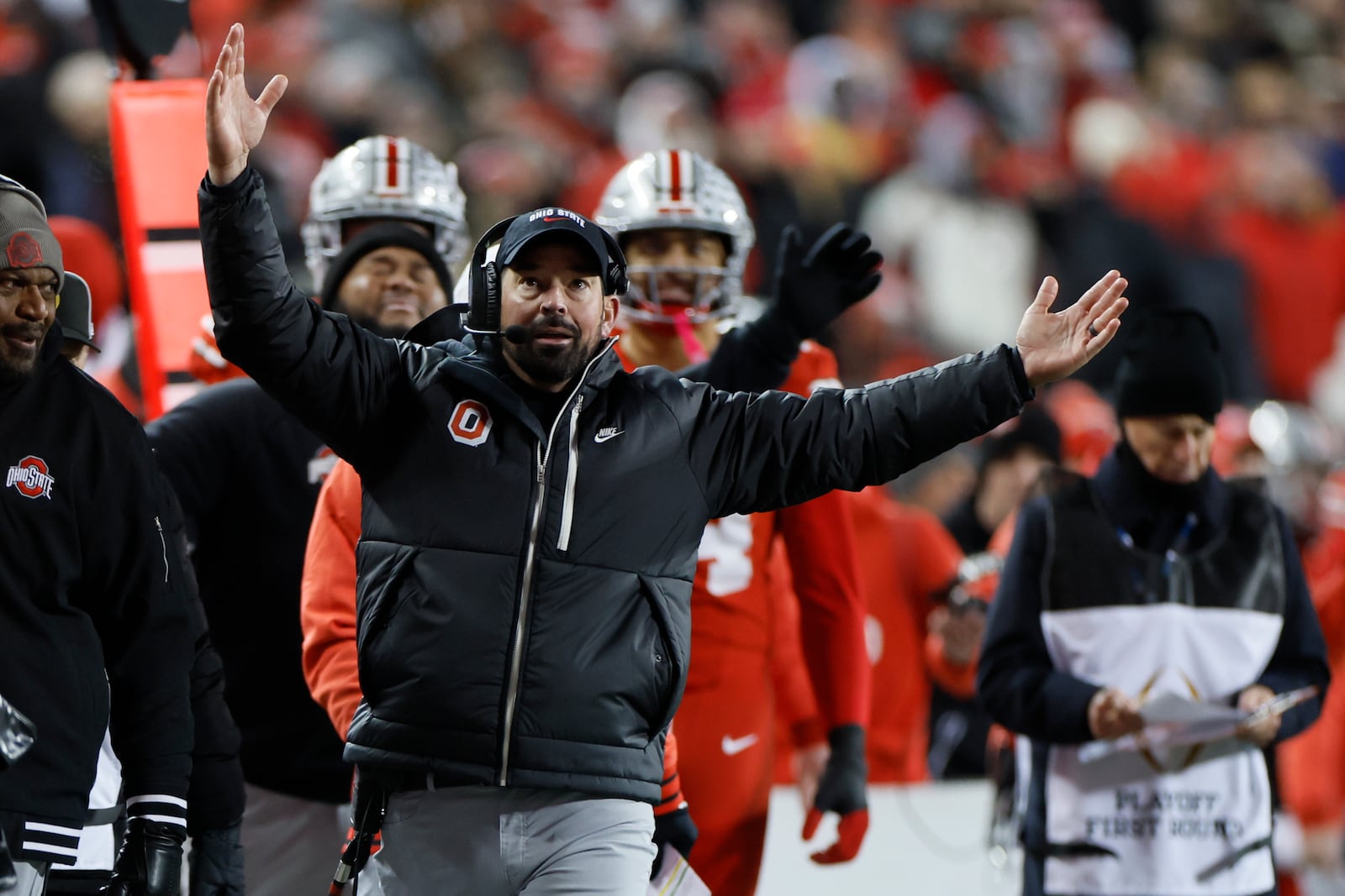 Ohio State head coach Ryan Day, front, reacts to the video replay during the first half in the first round of the College Football Playoff against Tennessee, Saturday, Dec. 21, 2024, in Columbus, Ohio. (AP Photo/Jay LaPrete)