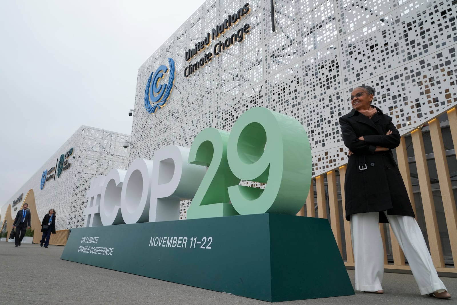 Marina Silva, Brazil environment minister, stands near a sign for the COP29 U.N. Climate Summit, Saturday, Nov. 23, 2024, in Baku, Azerbaijan. (AP Photo/Sergei Grits)