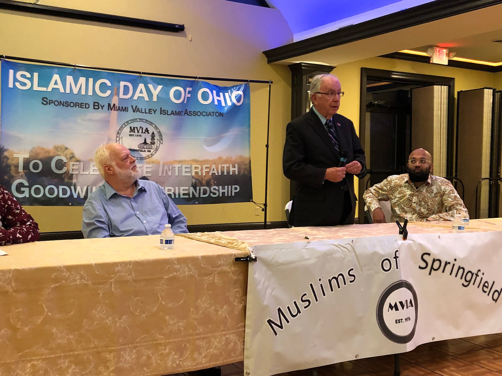 Dave Hobson, former U.S. Representative of the 7th Congressional District, Ohio was the guest of honor at the Islamic Day of Ohio event in Springfield on Saturday. Springfield Mayor Warren Copeland is on the left and the evening's keynote speaker Aman Ali on the right listening to Hobson. Photo by Brett Turner