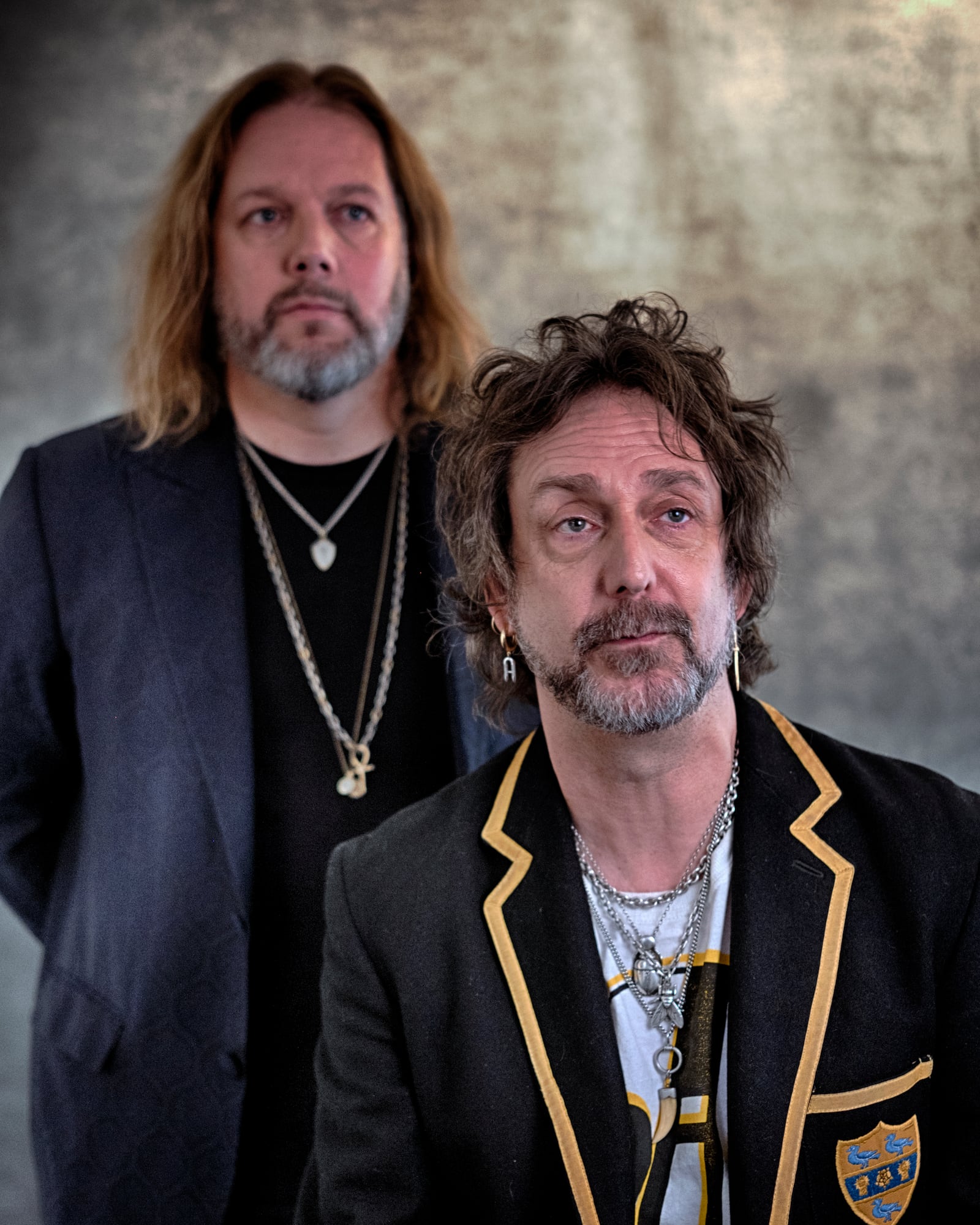 Rich Robinson, left, and his brother Chris Robinson of The Black Crowes pose for a portrait in Los Angeles on Monday, Dec. 9, 2024. (AP Photo/Richard Vogel)