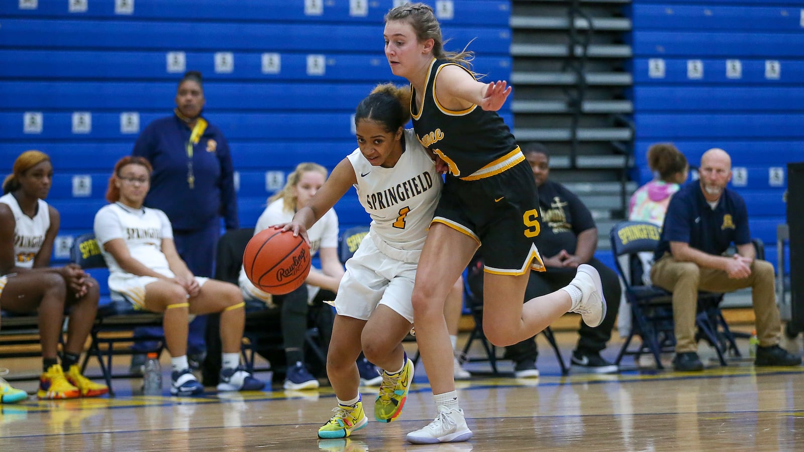 Springfield High School sophomore T'hanna Eubanks drives past Shawnee's Lydia Spitzer during their against Shawnee on Nov. 20 in Springfield. Michael Cooper/CONTRIBUTED