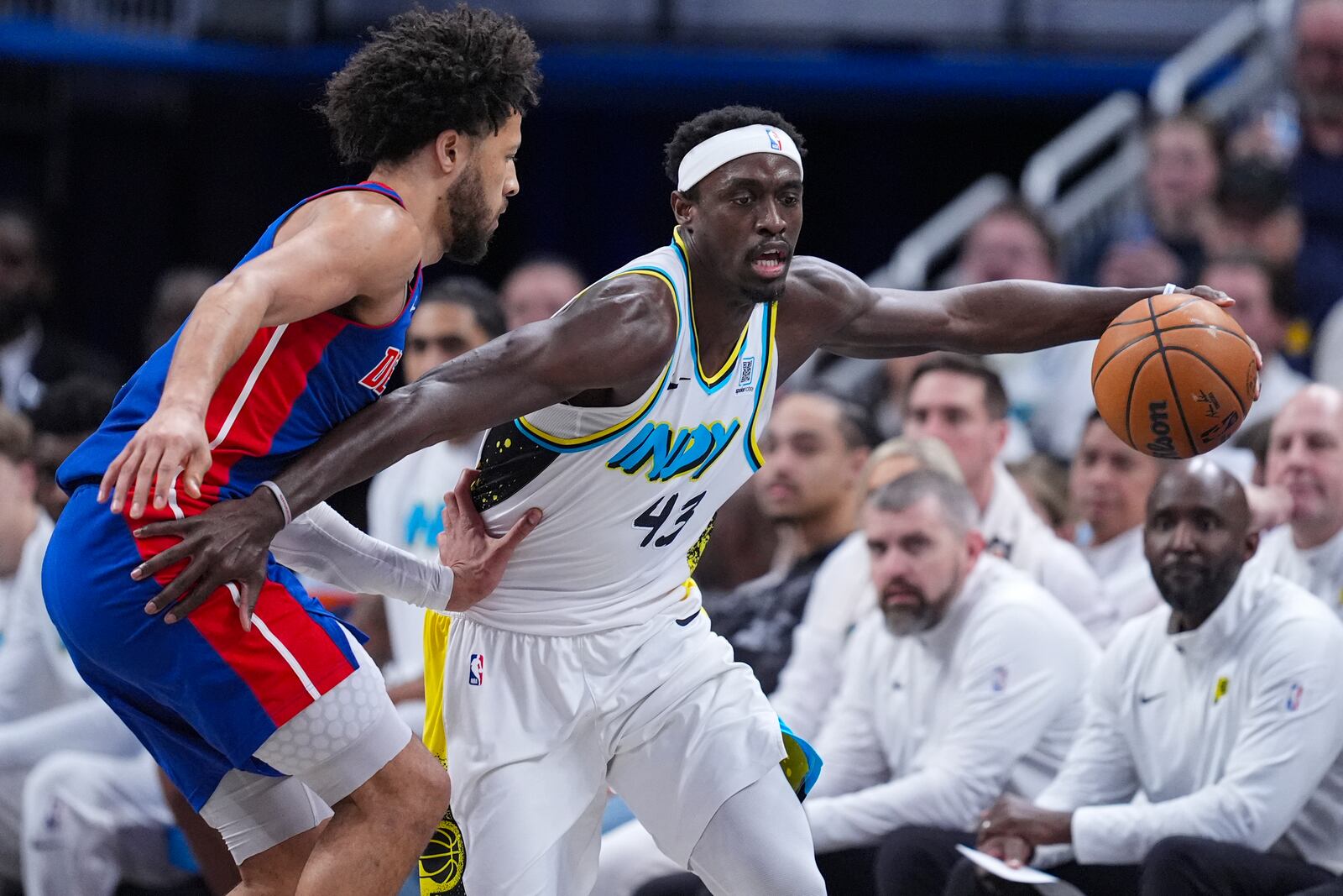 Detroit Pistons guard Cade Cunningham (2) defends Indiana Pacers forward Pascal Siakam (43) during the first half of an NBA basketball game in Indianapolis, Wednesday, Jan. 29, 2025. (AP Photo/Michael Conroy)