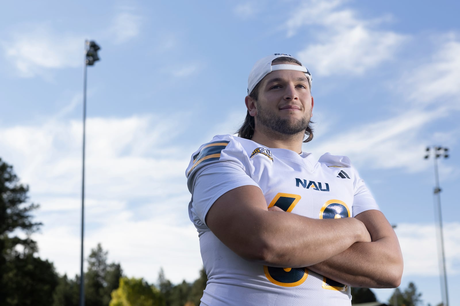 Northern Arizona University's Jonny Bottorff took advantage of new NIL money making opportunities and rebooted his college football career. Bottorff poses for a photo on the campus on NAU on Monday, Oct. 28, 2024, in Flagstaff, Ariz. (AP Photo/Josh Biggs)