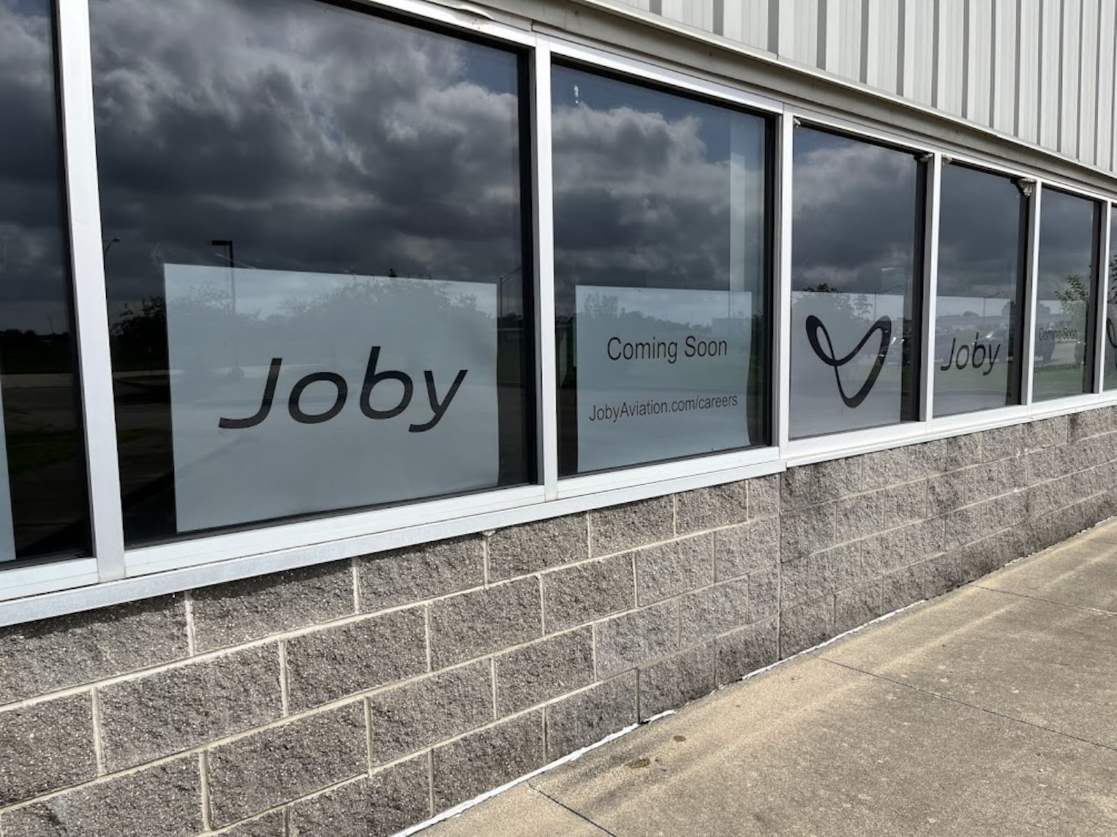 In a photo taken in August 2024, Joby Aviation placards could be seen in the windows of the former U.S. Postal Service facility on Concorde Drive near the Dayton International Airport. THOMAS GNAU/STAFF