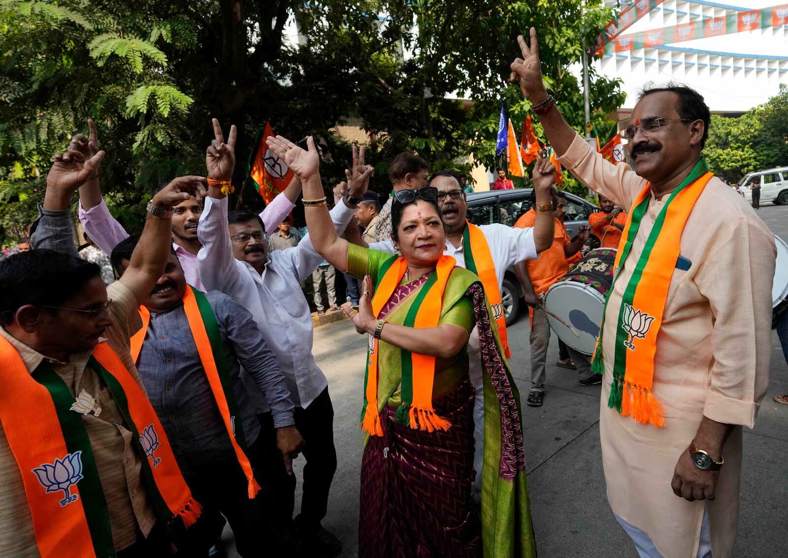 Bhartiya Janata Party workers celebrates after leading in Maharashtra state assembly elections in Mumbai, India, Saturday, Nov 23, 2024.(AP Photo/Rajanish Kakade)