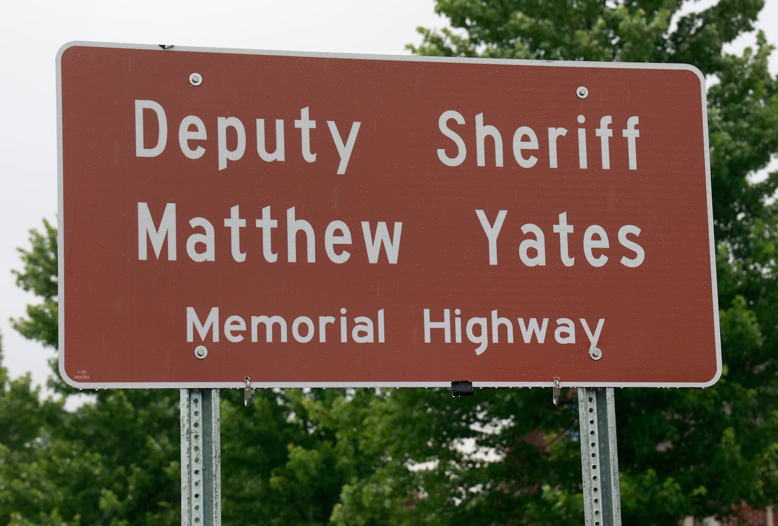 A dedication ceremony was held Tuesday, June 13, 2023 for the Deputy Sheriff Matthew Yates Memorial Highway along U.S. 40 near Tuttle Road. The ceremony featured the unveiling of a new sign naming the highway after Deputy Yates, who was killed last year in the line of duty. BILL LACKEY/STAFF