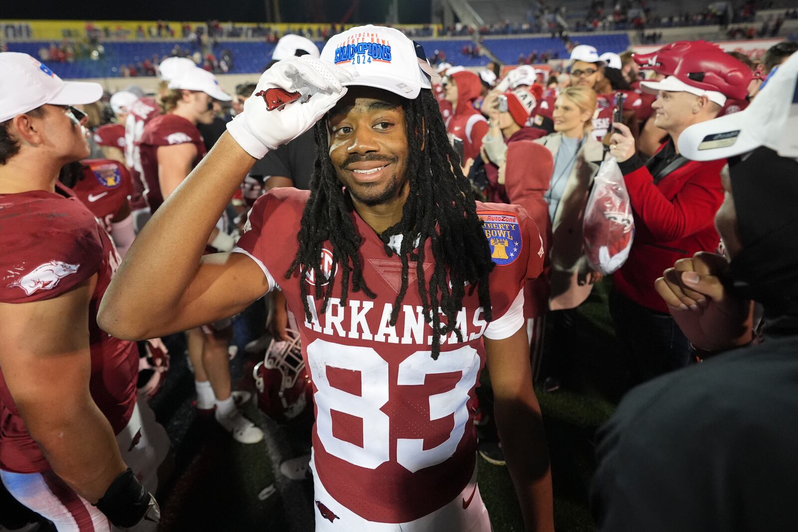 Arkansas wide receiver Dazmin James (83) celebrates the team's win against Texas Tech after the Liberty Bowl NCAA college football game Friday, Dec. 27, 2024, in Memphis, Tenn. (AP Photo/George Walker IV)