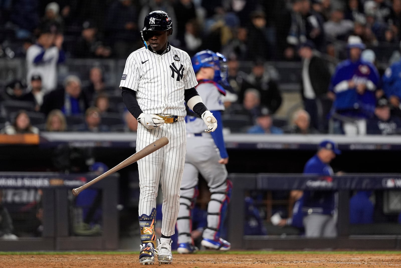 New York Yankees' Jazz Chisholm Jr. throws his bat after striking out to end the eighth inning in Game 3 of the baseball World Series against the Los Angeles Dodgers, Monday, Oct. 28, 2024, in New York. (AP Photo/Godofredo A. Vásquez)