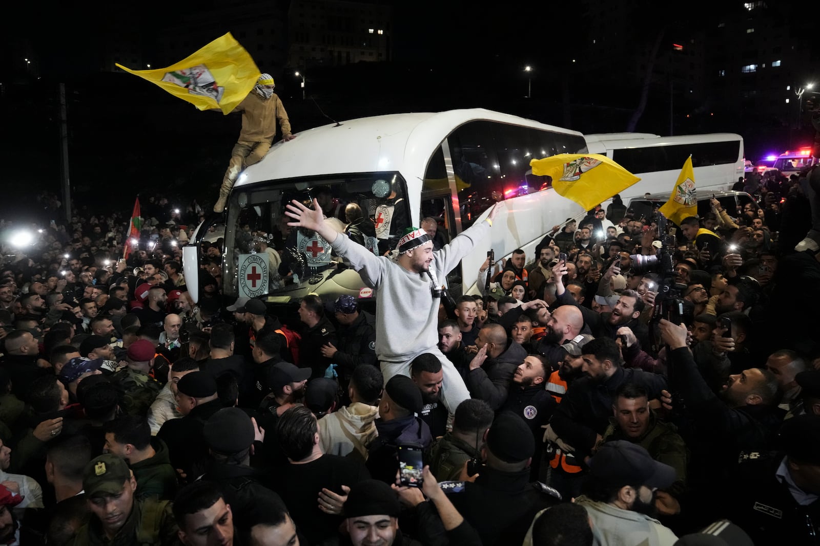 Crowd greets Palestinian prisoners after being released from Israeli prison following a ceasefire agreement between Israel and Hamas, in the West Bank city of Ramallah, Thursday, Jan. 30, 2025. (AP Photo/Mahmoud Illean)