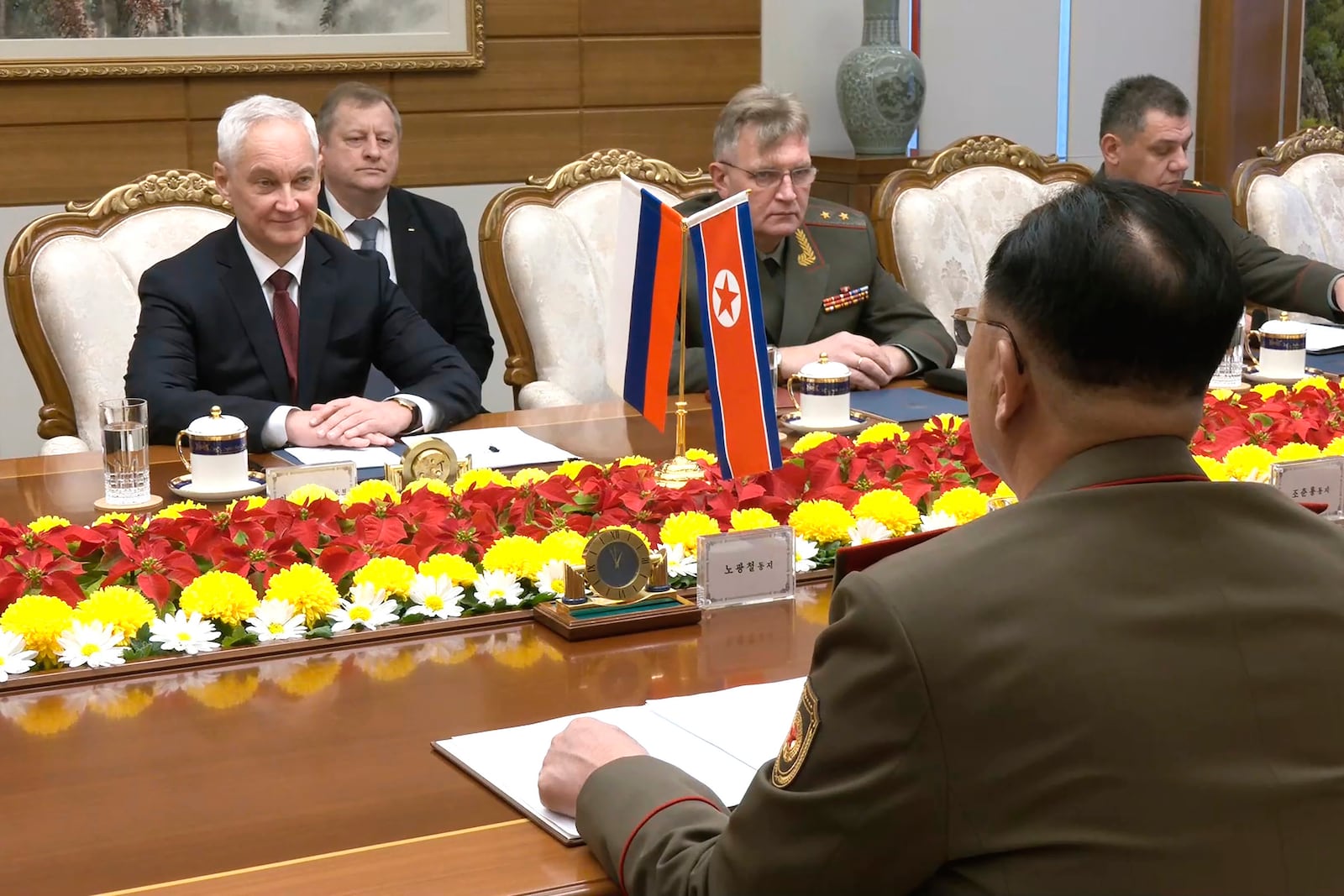 In this photo taken from a video released by Russian Defense Ministry press service, Russian Defense Minister Andrei Belousov, left, speaks with North Korean Defense Minister No Kwang Chol, unseen, during their meeting in Pyongyang, North Korea Friday, Nov. 29, 2024. (Russian Defense Ministry Press Service via AP)