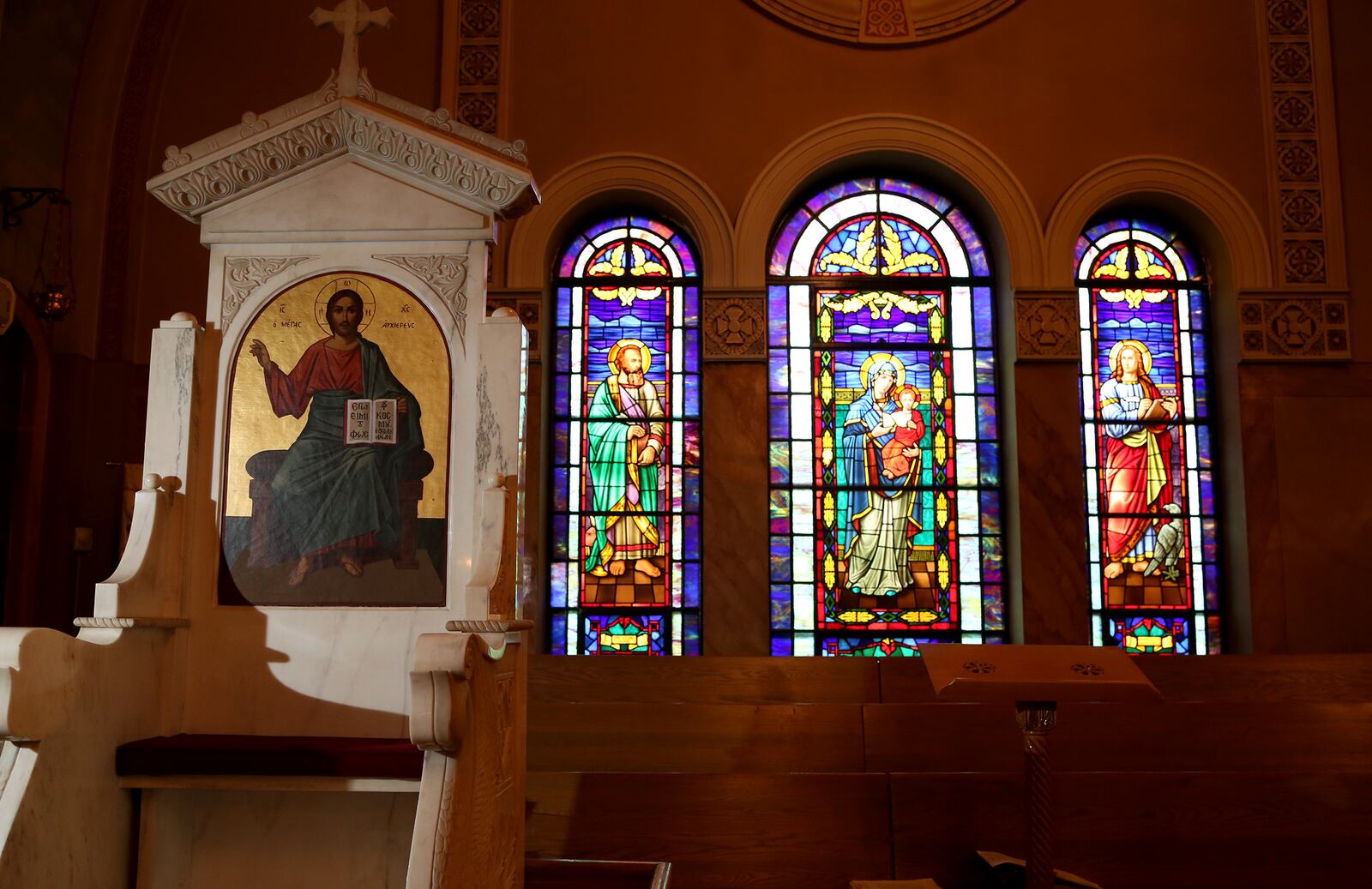 The Bishop's throne (left) is flanked by stained glass windows just before the sanctuary at Annunciation Greek Orthodox Church, 500 Belmonte Park North in Dayton. LISA POWELL / STAFF