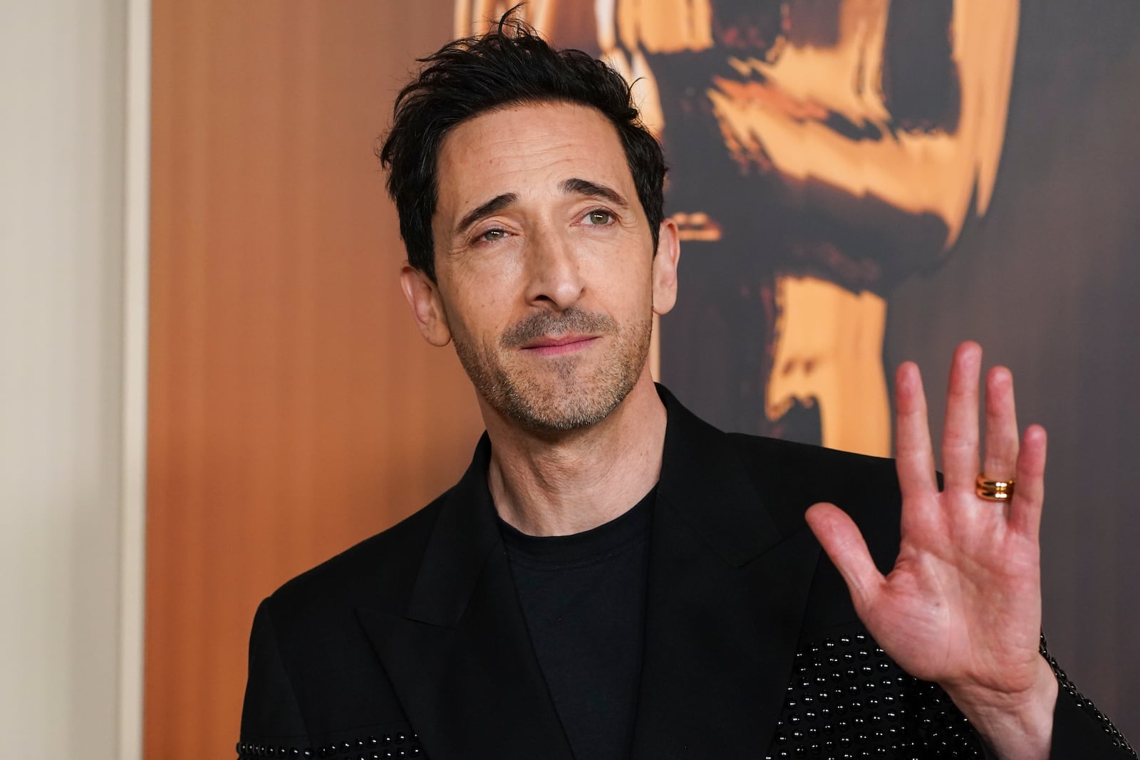 Adrien Brody arrives at the Oscars Nominees Dinner on Tuesday, Feb. 25, 2025, at the Academy Museum of Motion Pictures in Los Angeles. (Photo by Jordan Strauss/Invision/AP)