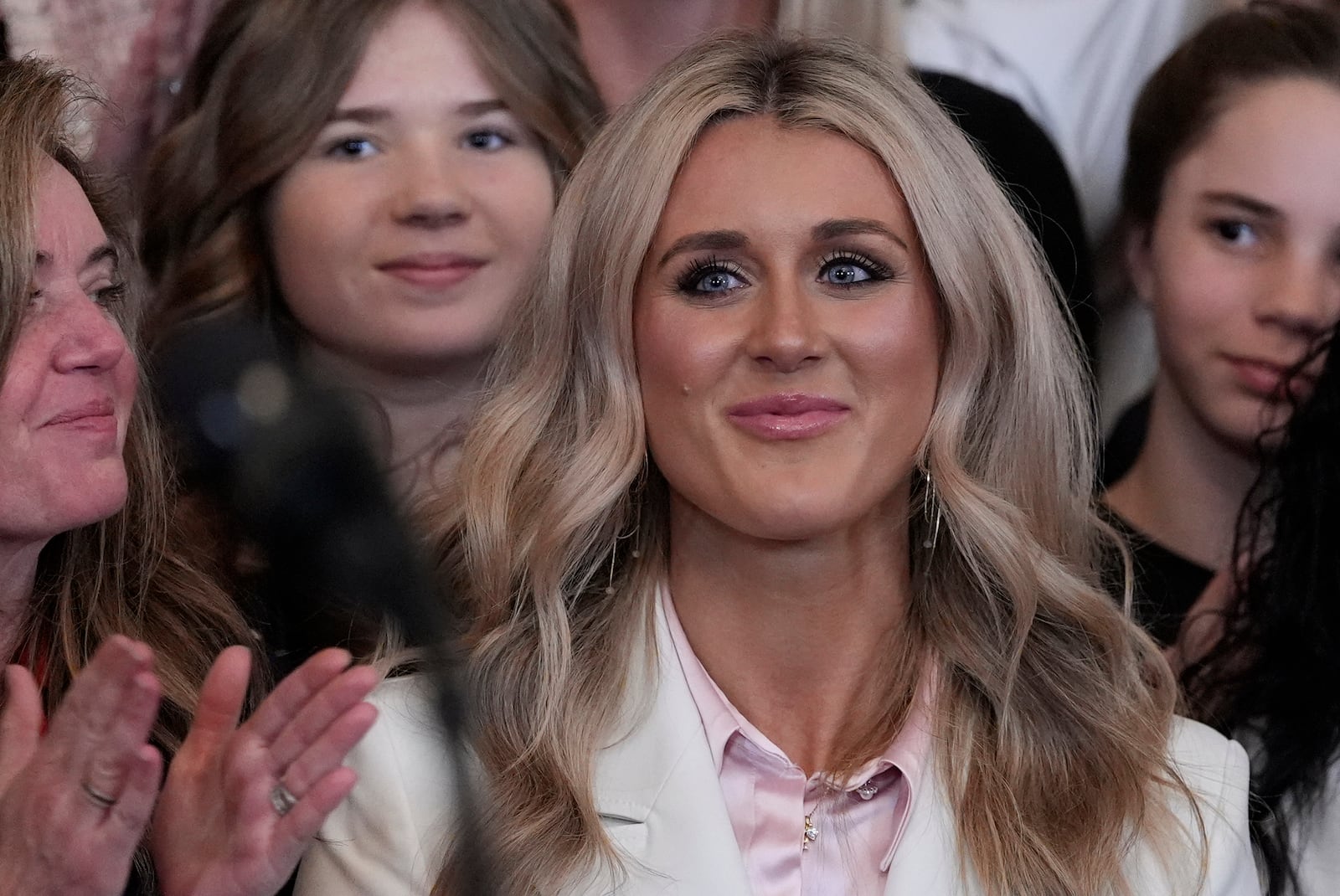 President Donald Trump acknowledges Riley Gaines as he speaks before signing an executive order barring transgender female athletes from competing in women's or girls' sporting events, in the East Room of the White House, Wednesday, Feb. 5, 2025, in Washington. (AP Photo/Alex Brandon)