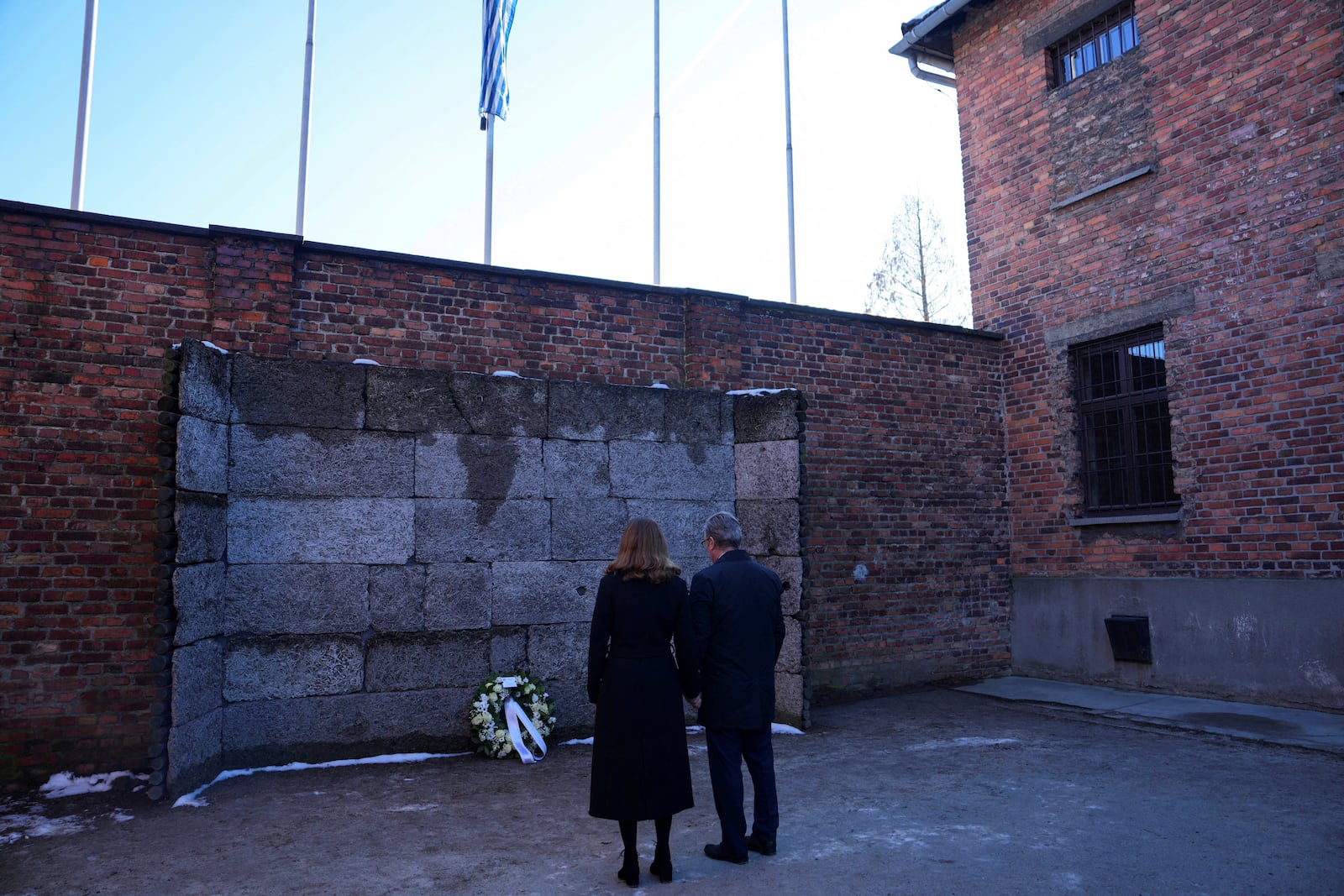 Britain's Prime Minister Keir Starmer and his wife Victoria Starmer visit the Memorial And Museum Auschwitz-Birkenau, a former Nazi German concentration and extermination camp, in Oswiecim, Poland, Friday Jan. 17, 2025. (Aleksandra Szmigiel/Pool via AP)