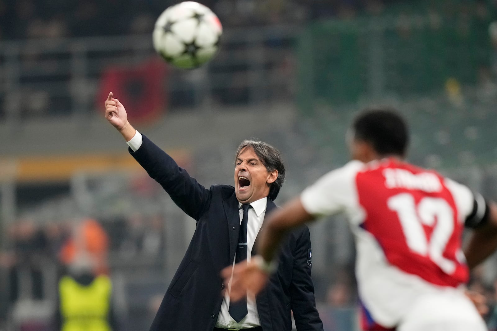 Inter Milan's head coach Simone Inzaghi gives instructions during a Champions League opening phase soccer match between Inter Milan and Arsenal at the San Siro stadium in Milan, Italy, Wednesday, Nov. 6, 2024. (AP Photo/Luca Bruno)