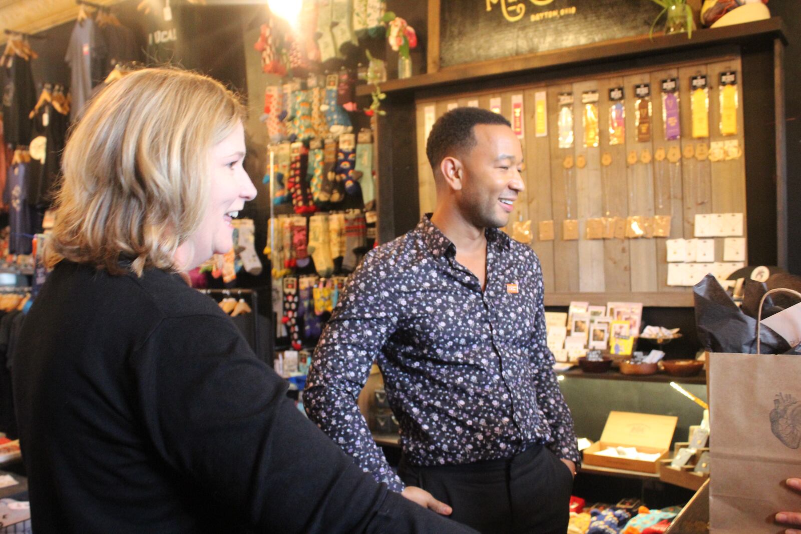 John Legend made a surprise visit to the Oregon District Sunday evening with Dayton Mayor Nan Whaley to show support in the aftermath of the mass shooting Sunday, Aug. 4. He stopped by a number of stores to shop including Heart Mercantile, Brim on Fifth, Puff Apothecary and Beck + Call. AMELIA ROBINSON / STAFF