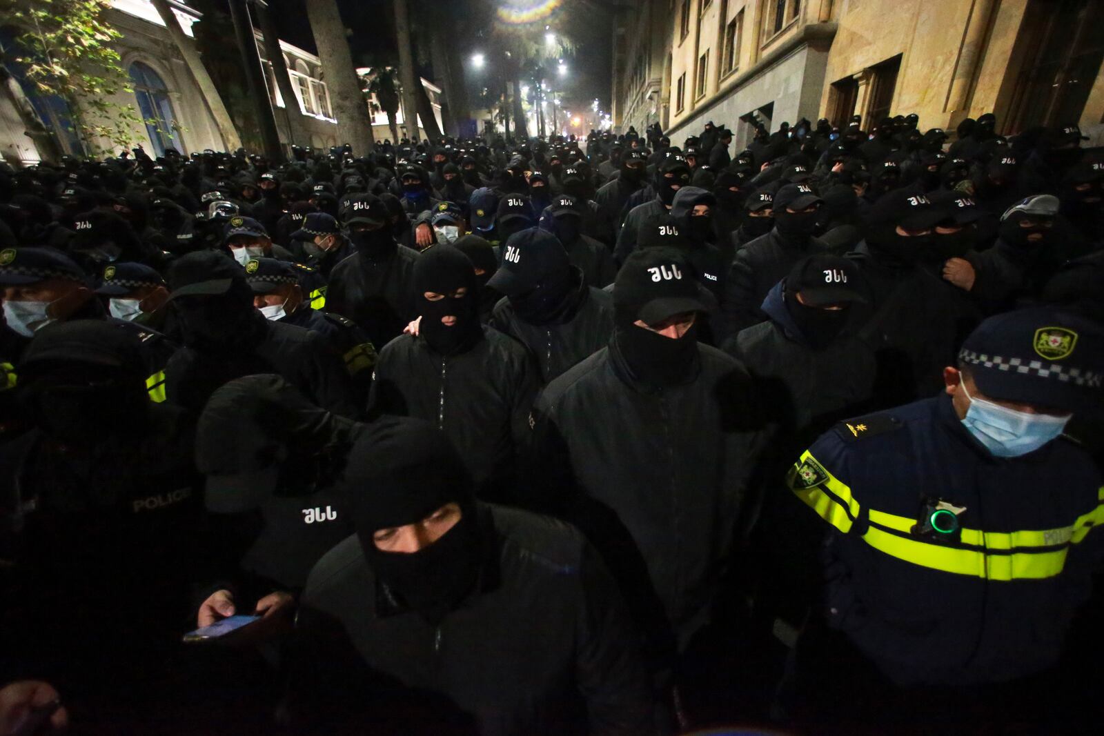 The police block the way to demonstrators during a rally outside the parliament's building to protest the government's decision to suspend negotiations on joining the European Union for four years in Tbilisi, Georgia, on Saturday, Nov. 30, 2024. (AP Photo/Zurab Tsertsvadze)