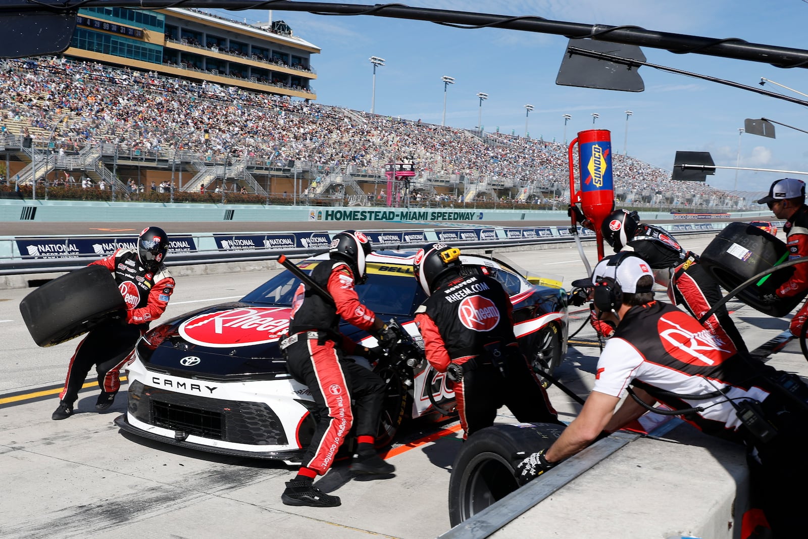 Christopher Bell makes a pit stop during a NASCAR Cup Series auto race at Homestead-Miami Speedway in Homestead, Fla., Sunday, Oct. 27, 2024. (AP Photo/Terry Renna)