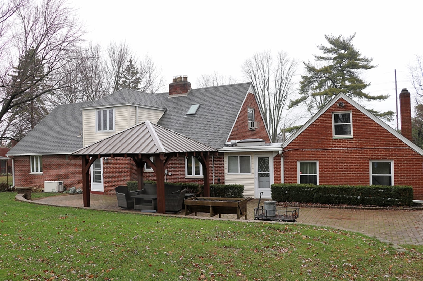 Sitting well off the road on 1.68 acres with mature trees and a pavilion covered paver-brick patio, the homestead at 4625 Wilmington Pike in Kettering has about 2,700 square feet of living space. Listed for $449,987 by Berkshire Hathaway Home Services Professional Realty, the property includes two large storage barns and a potting shed, complete with electric sink and water. CONTRIBUTED