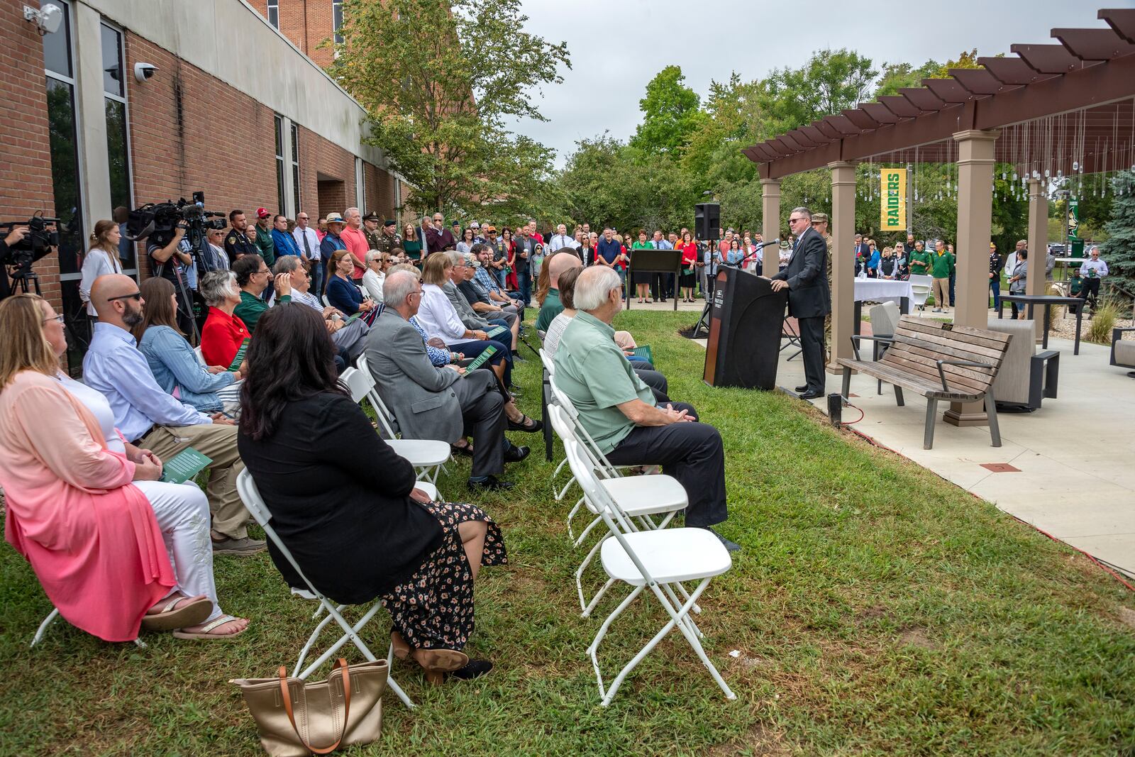 About 150 people attended the dedication ceremony Friday, Sept. 8, 2023, for the Captain Shawn L. English Champion Garden, an outdoor space that honors veterans, military-connected students and those who support them, outside the Veteran and Military Center at Wright State University. CHRIS SNYDER/WRIGHT STATE UNIVERSITY