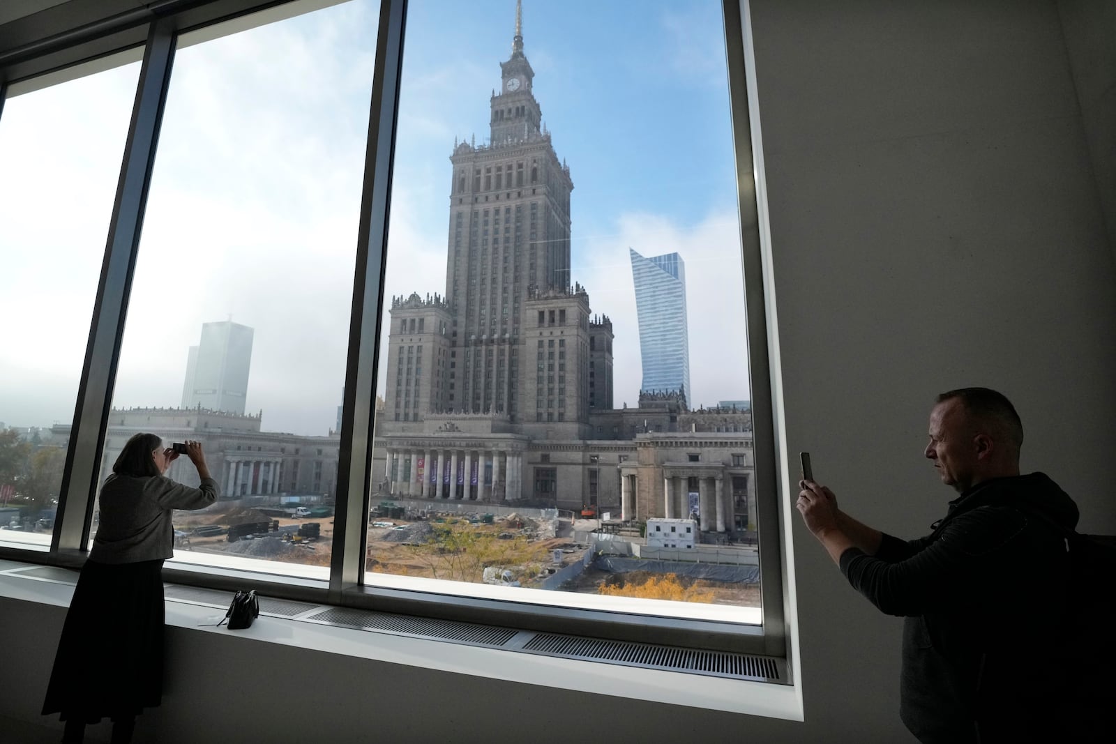 People look out of the window of the Museum of Modern Art in Warsaw, Poland, on Thursday Oct. 24, 2024. (AP Photo/Czarek Sokolowski)