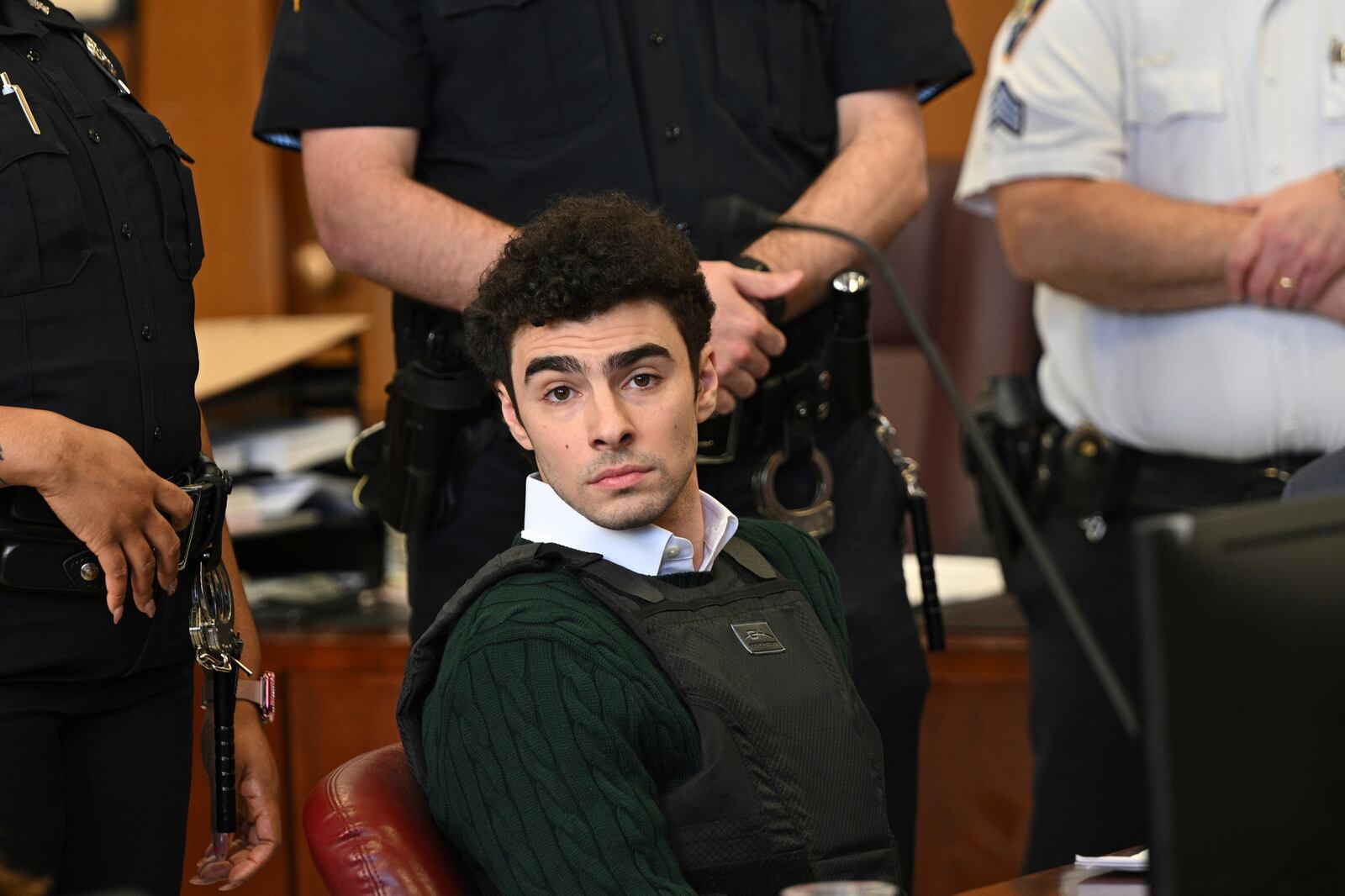 Luigi Mangione, accused of fatally shooting Brian Thompson, the CEO of UnitedHealthcare, appears in Manhattan state court in New York, Friday, Feb. 21, 2025. (Curtis Means/Pool Photo via AP)